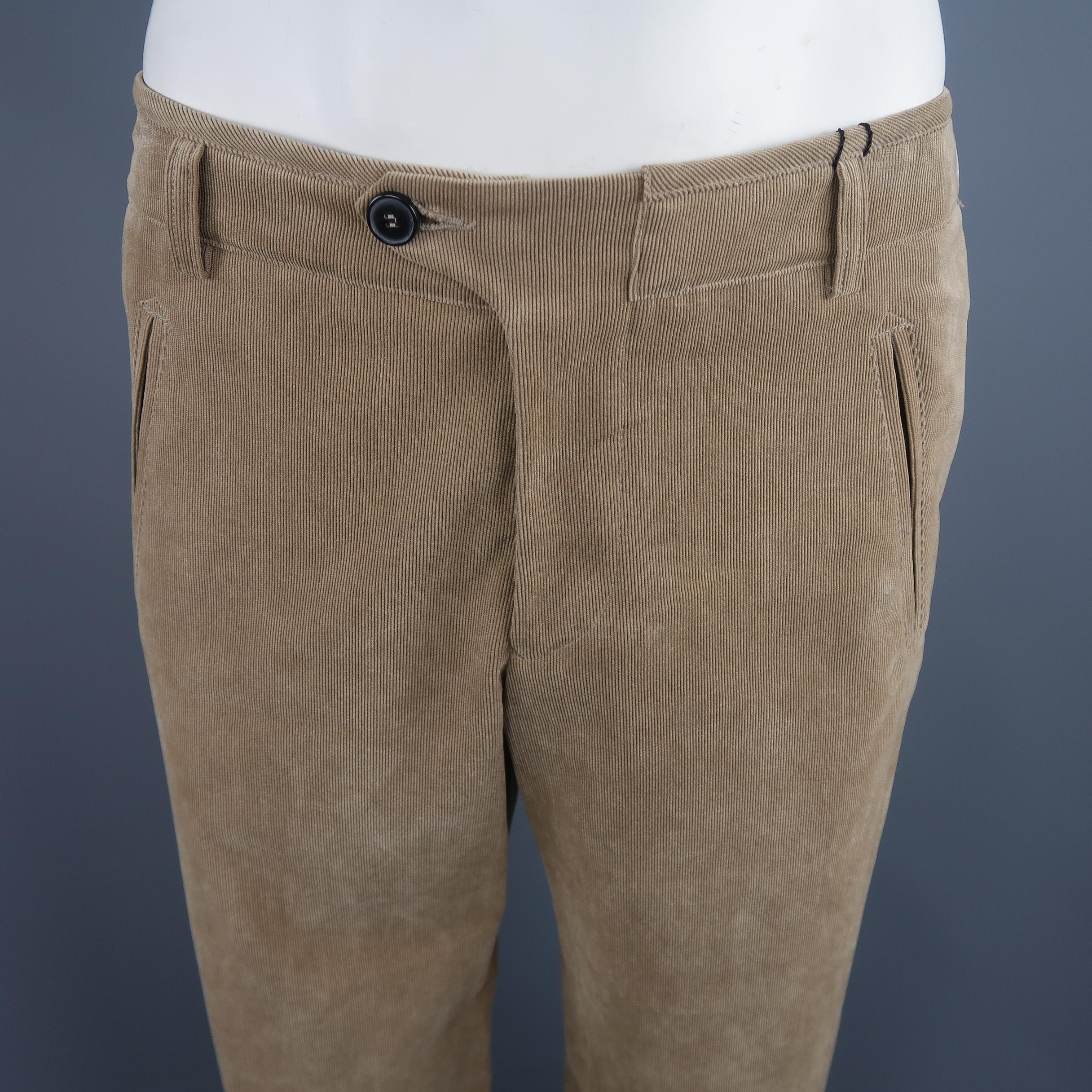 Giorgio Armani dress pants come in tan khaki corduroy with a button over waistband and slanted pockets. Made in Italy.
 
New with Tags.
Marked: IT 50
 
Measurements:
 
Waist: 34 in.
Rise: 10.5 in.
Inseam: 36 in.