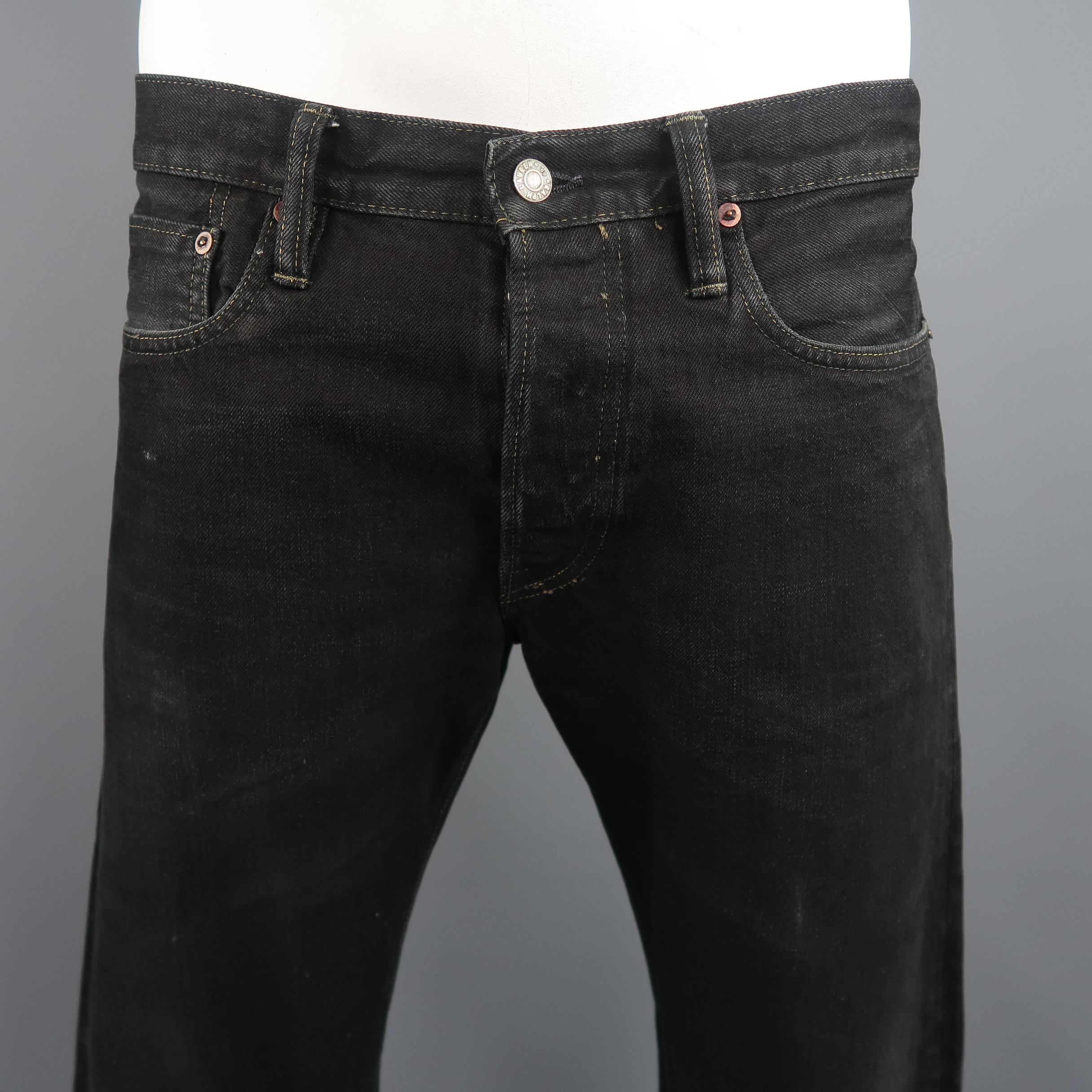 RRL by Ralph Lauren jeans come in washed black selvage denim with a slim leg and distressing throughout. Made in USA.
 
Good Pre-Owned Condition.
Marked: (no size)
 
Measurements:
 
Waist: 36 in.
Rise: 10.5 in.
Inseam:  32 in.