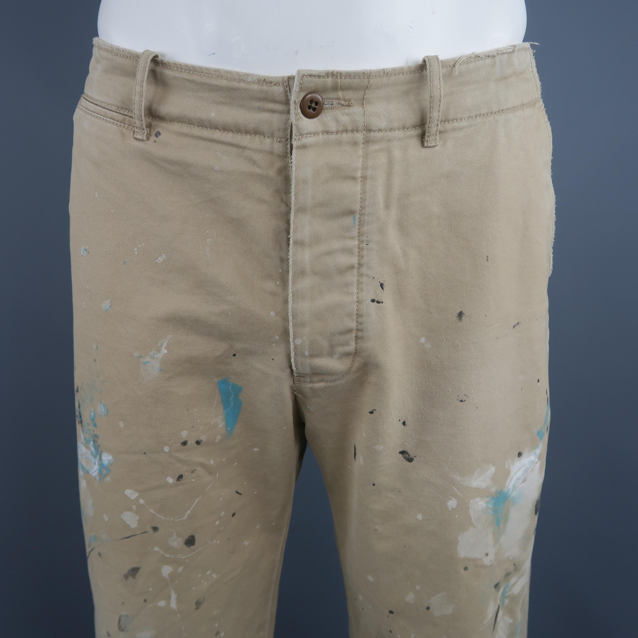 Polo Ralph Lauren chinos come in classic khaki cotton twill with distressed hems and paint splatters throughout.
 
Excellent Pre-Owned Condition.
Marked: 33
 
Measurements:
 
Waist: 34 in.
Rise: 11 in.
Inseam: 32 in.