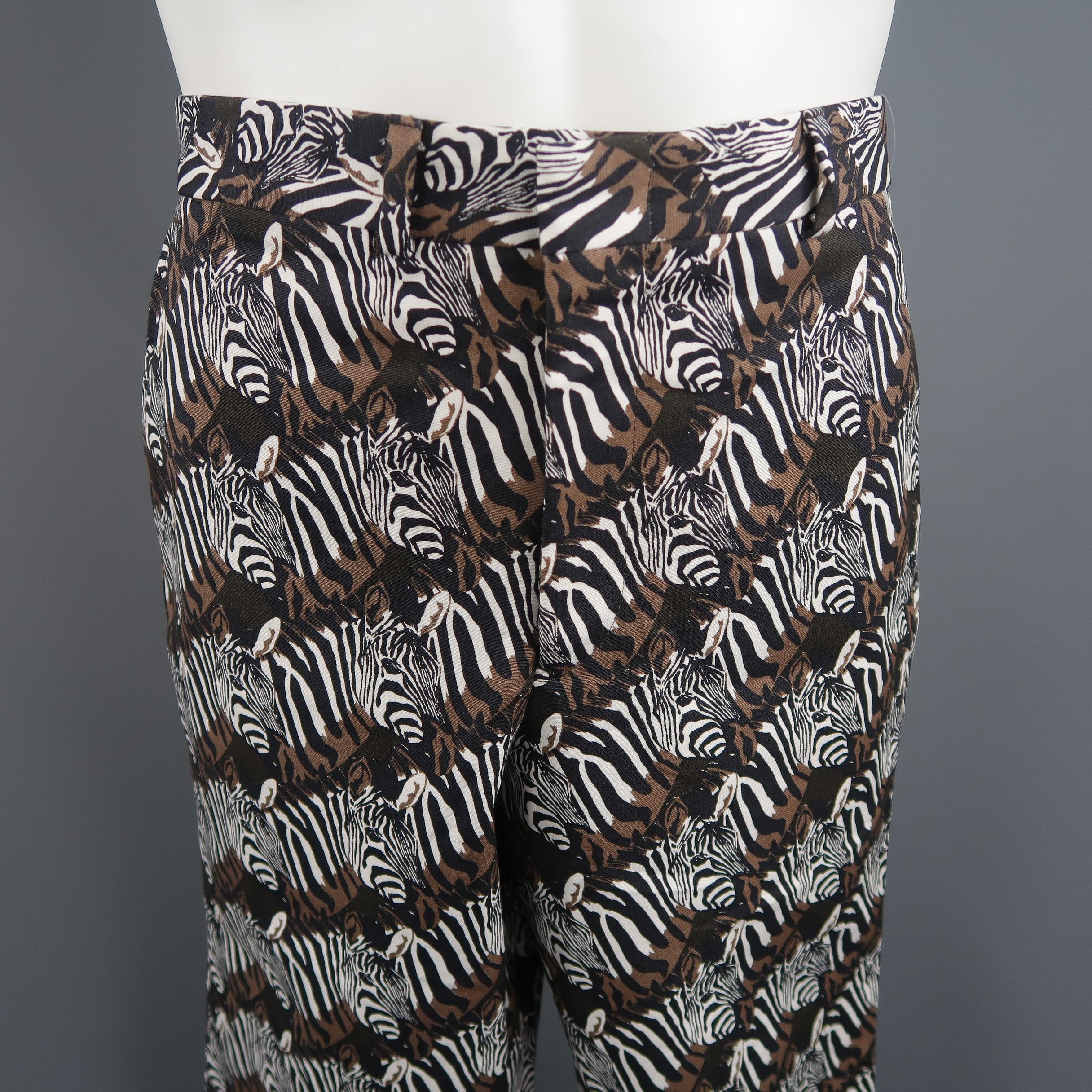 Gitman Vintage statement trousers come in a black, white, and brown zebra graphic print cotton canvas with welt pockets, and a tapered leg. Made in USA.
 
Brand New.
Marked: 33
 
Measurements:
 
Waist: 33 in.
Rise: 10 in.
Inseam: 35 in.