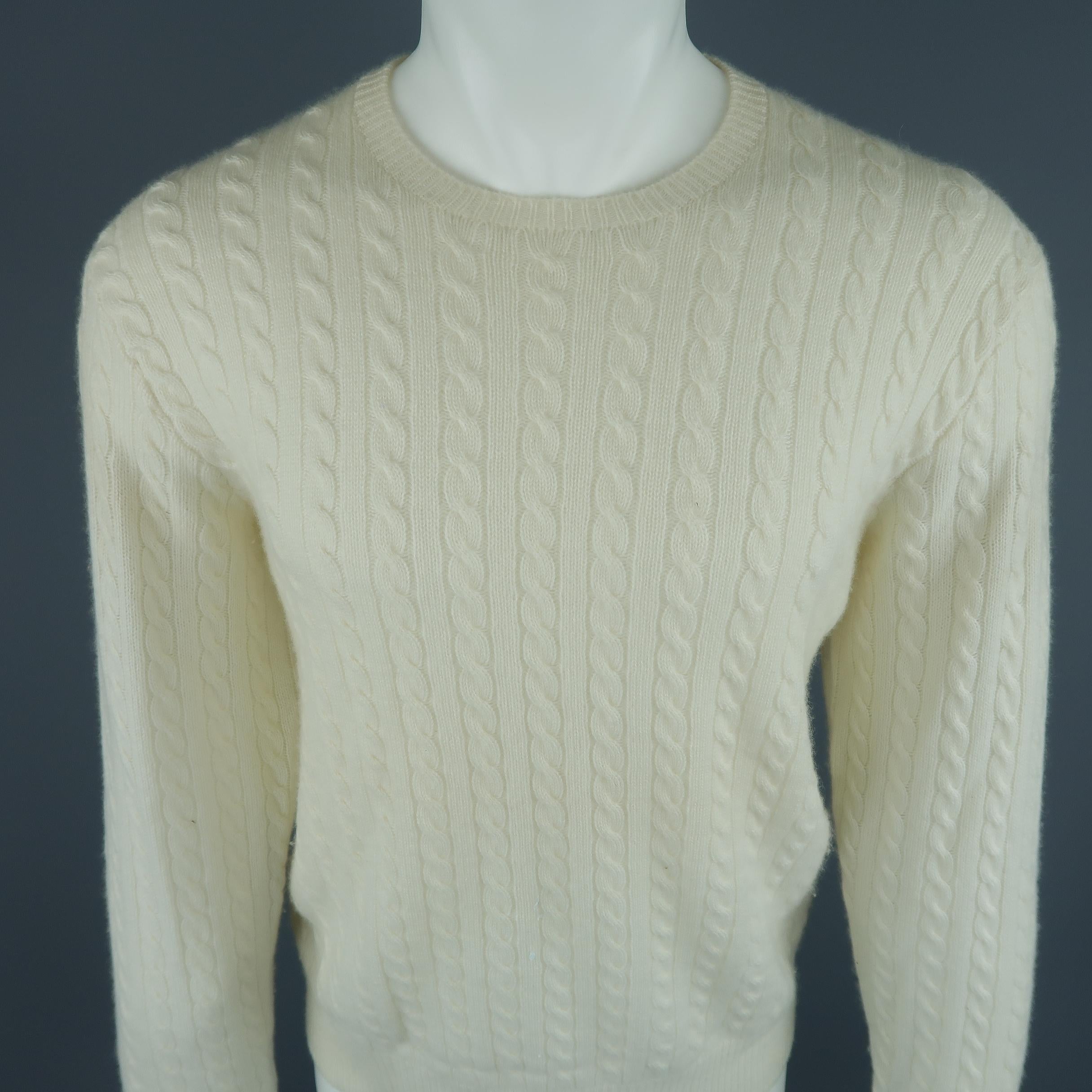 Polo Golf By Ralph Lauren sweater come in 100% Cashmere in an off white tone cable knit, with a crewneck and ribbed cuff and waistband. Made in Japan.
 
Fair Pre-Owned Condition, with little stains on the sleeves.
Marked: M
 
Measurements:
