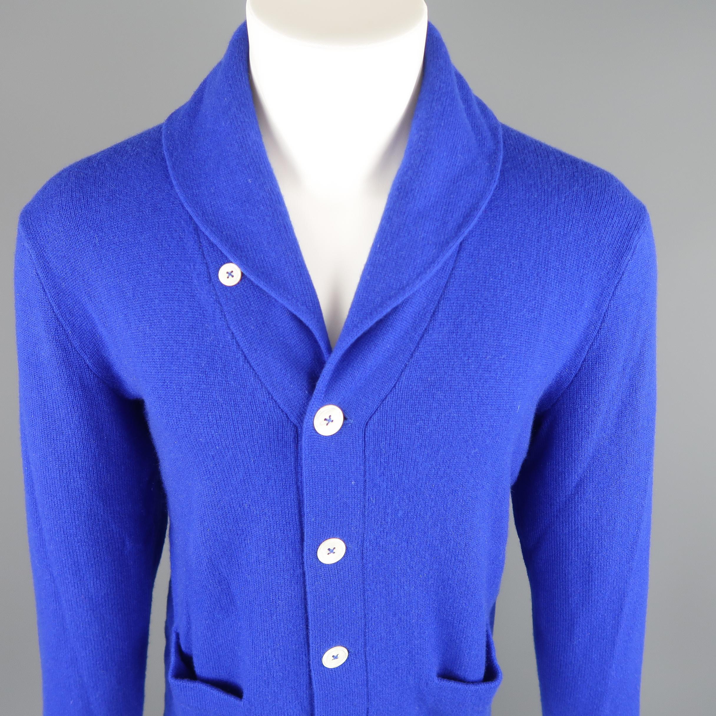 Polo By Ralph Lauren Size L cardigan come in 100% Cashmere in a royal blue tone knit, with a shawl collar, button down, front pockets and ribbed cuff and waistband.
 
Good  Pre-Owned Condition.
Marked: L
 
Measurements:
 
Shoulder: 20 in.
Chest: 23