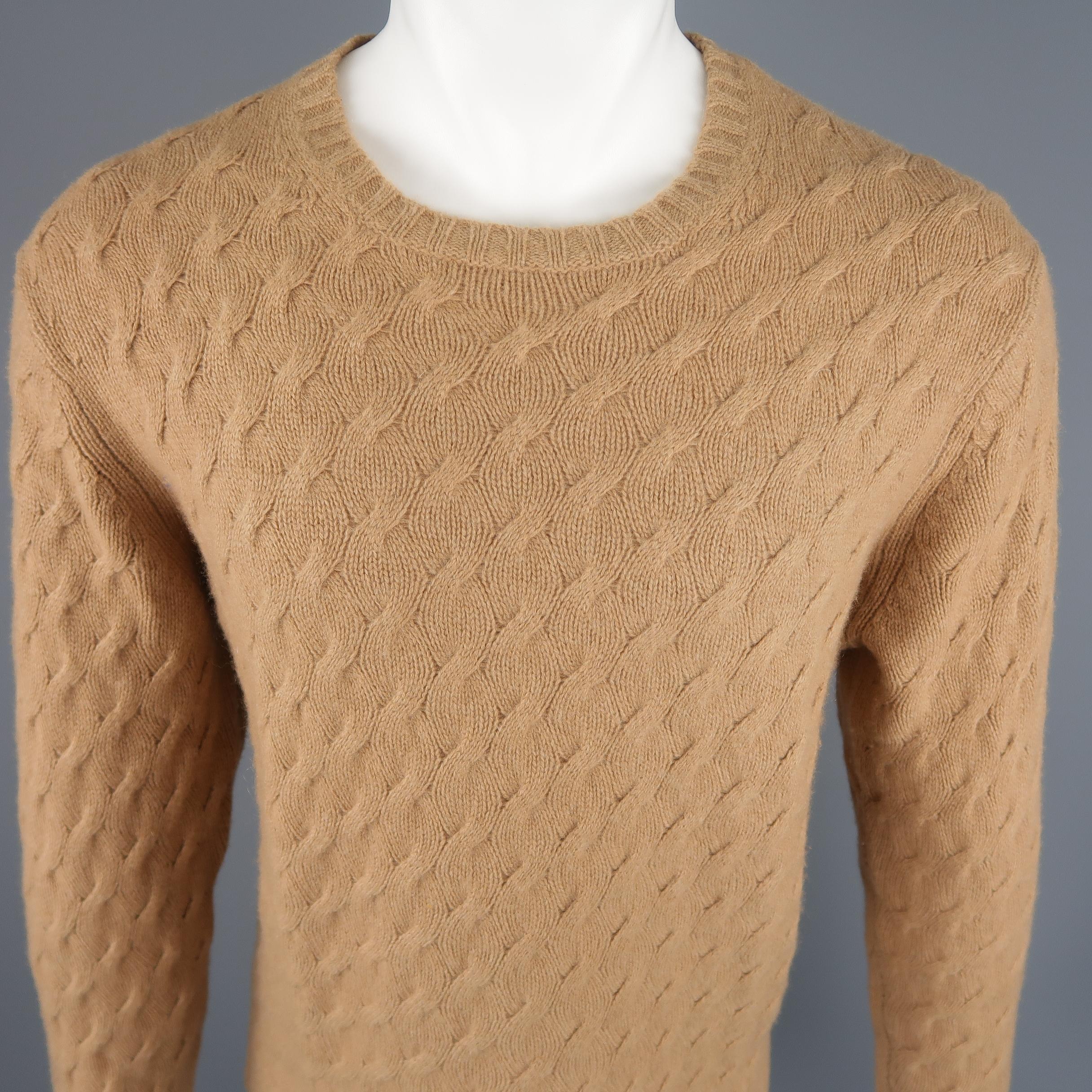 Tasso Elba  Size L  sweater come in 100% Cashmere in a tan tone cable knit, with a crewneck and ribbed cuff and waistband.
 
Excellent  Pre-Owned Condition.
Marked: L
 
Measurements:
 
Shoulder: 19 in.
Chest: 23 in.
Sleeve: 27 in.
Length: 27 in.