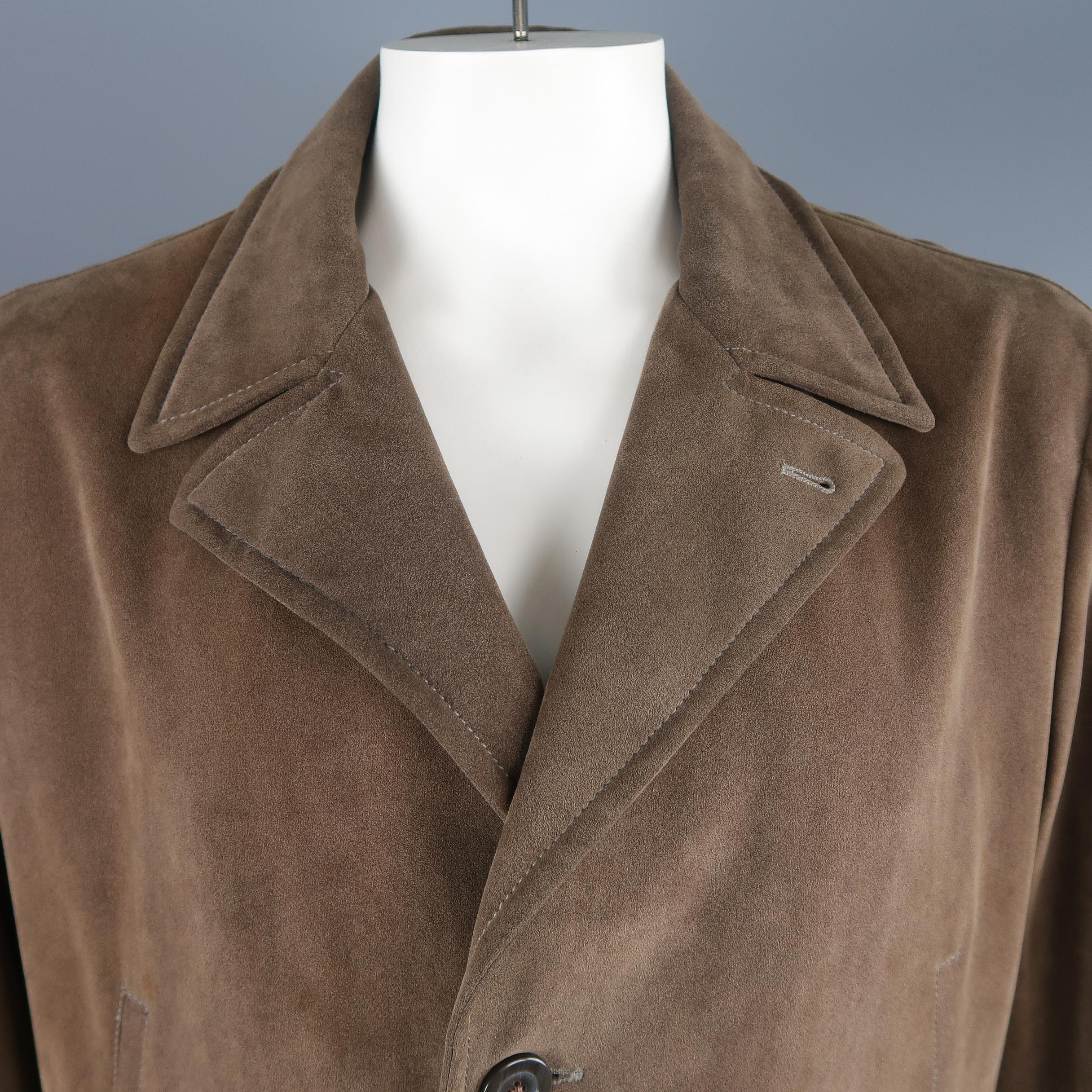 Armani Collezioni coat comes in taupe microsuede with a pointed lapel, three button front, slanted, zip, and flap pockets, and tab cuffs. Wear consistent with age. Made in Italy.
 
Good Pre-Owned Condition.
Marked: IT 56
 
Measurements:
 
Shoulder: