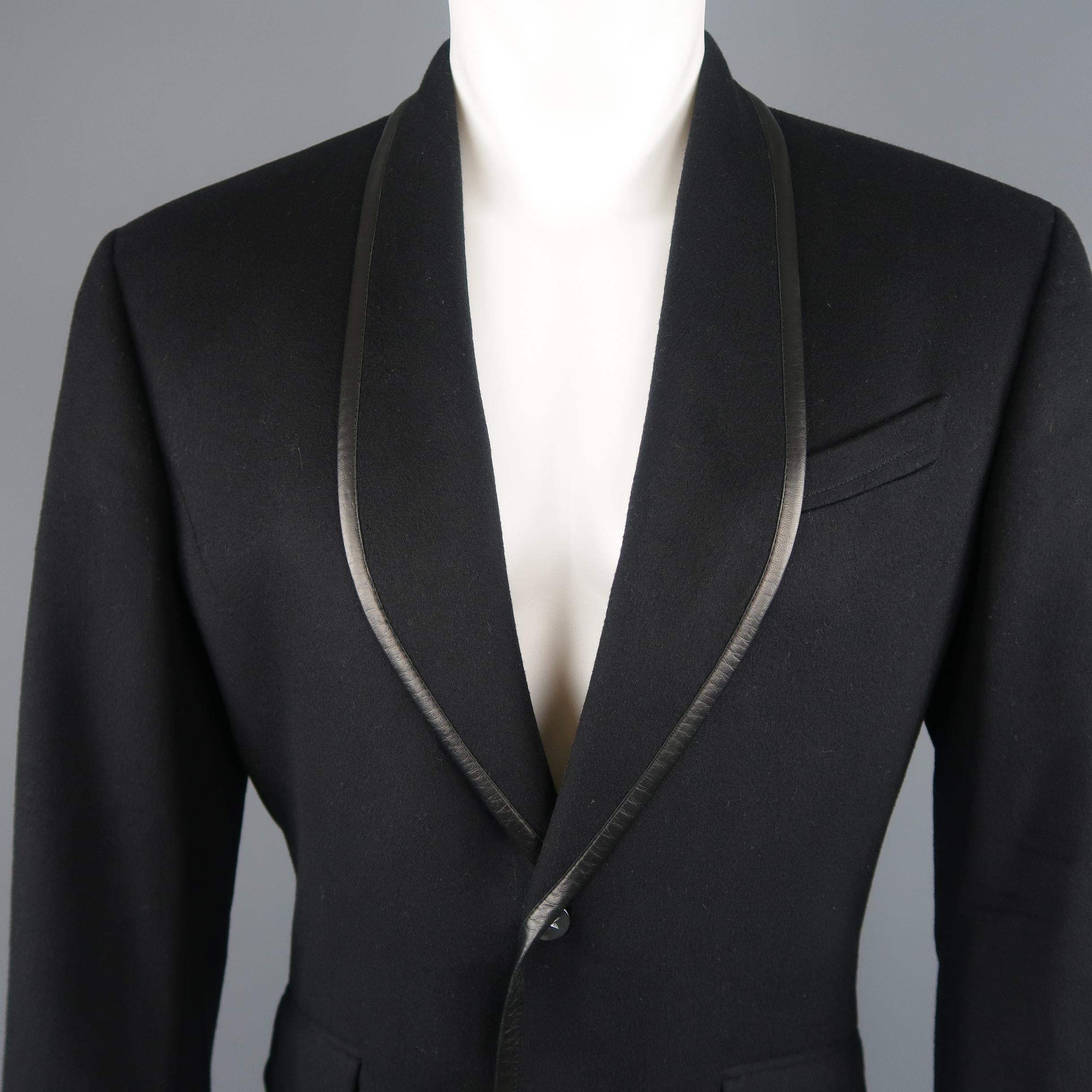 Vintage Thierry Mugler sport jacket comes in a wool cashmere blend felt with a shawl collar, two metal star snap closure, flap pockets, and leather piping. Made in France.
 
Excellent Pre-Owned Condition.
Marked: EU 48
 
Measurements:
 
Shoulder: 19