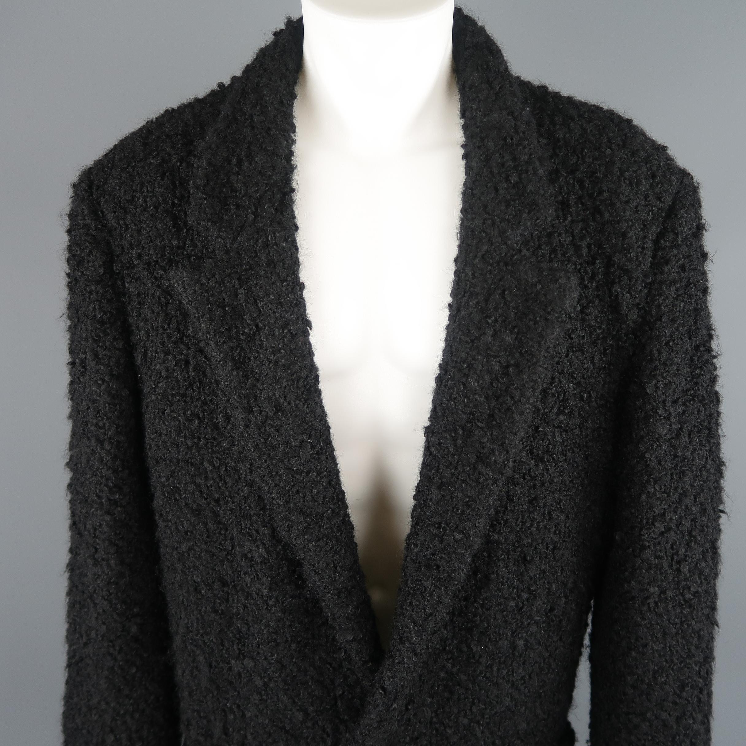 Vintage 1990's 38  Gianni Versace overcoat comes in a wool mohair fur textured fabric with singe leather covered button closure, quilted liner, and a notch lapel. Wear on buttons. As-is. Made in Italy.
 
Good Pre-Owned Condition.
Marked: IT 48
