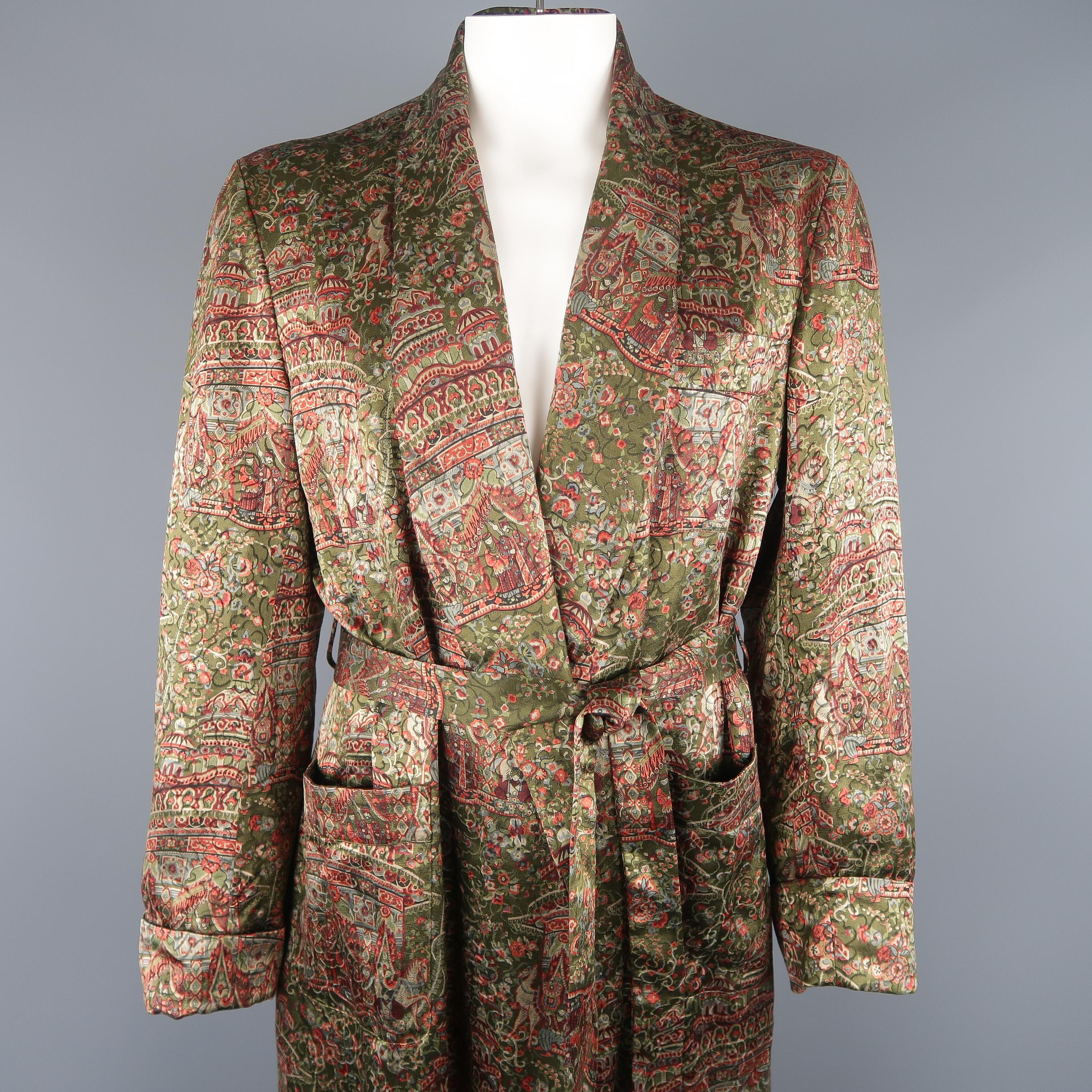 Vintage Hermes robe come in olive green textured satin with an all over Persian influenced print, shawl collar lapel, patch pockets, and belt tied waist. Minor wear. Made in France.
 
Good Pre-Owned Condition.
Marked: EU 54
 
Measurements:
