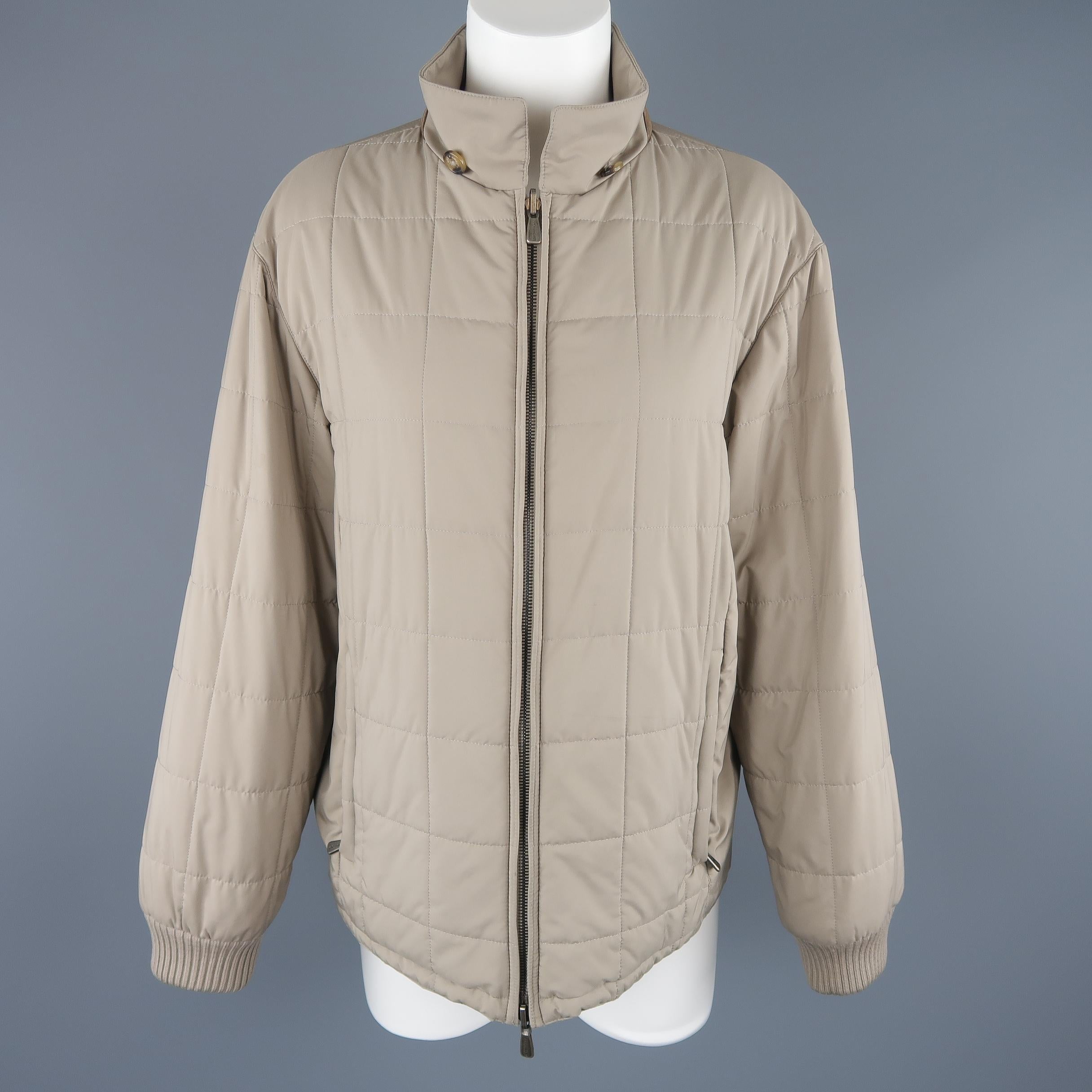 Loro Piana jacket comes in khaki beige quilted fabric with a pointed collar, double zip closure, and ribbed knit cuffs. Wear. As-is. Made in Italy.
 
Good Pre-Owned Condition.
Marked: L
 
Measurements:
 
Shoulder:19 in.
Bust: 42 in.
Sleeve: 23