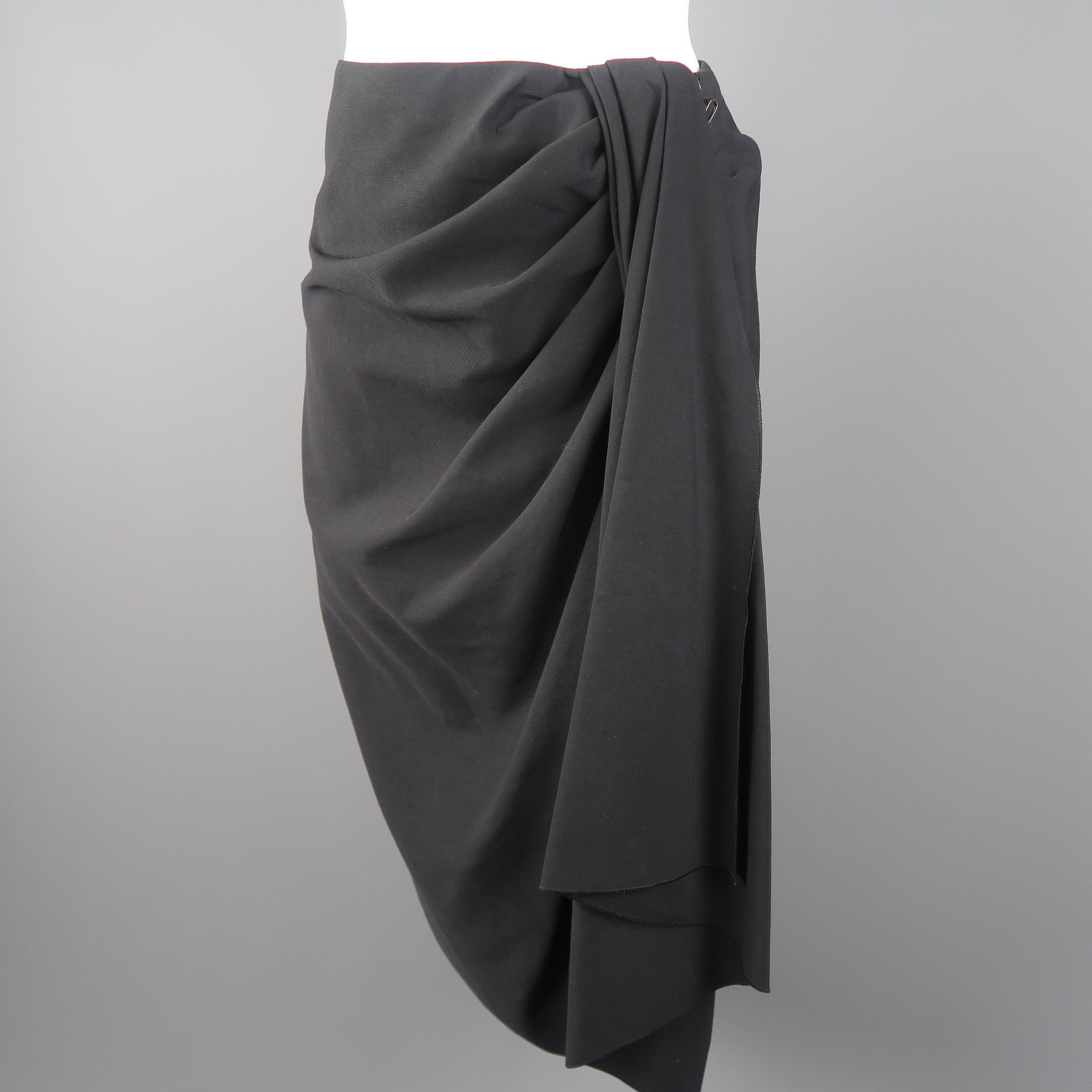 Lanvin asymmetrical skirt, come in wool in black tone and frontal draped detail, with exposed zipper. Fall / winter 2007. Made in France.
 
Good  Pre-Owned Condition.
Marked: 40
 
Measurements:
 
Waist: 30 in.
Hip: 40 in.
Length: 30 in.