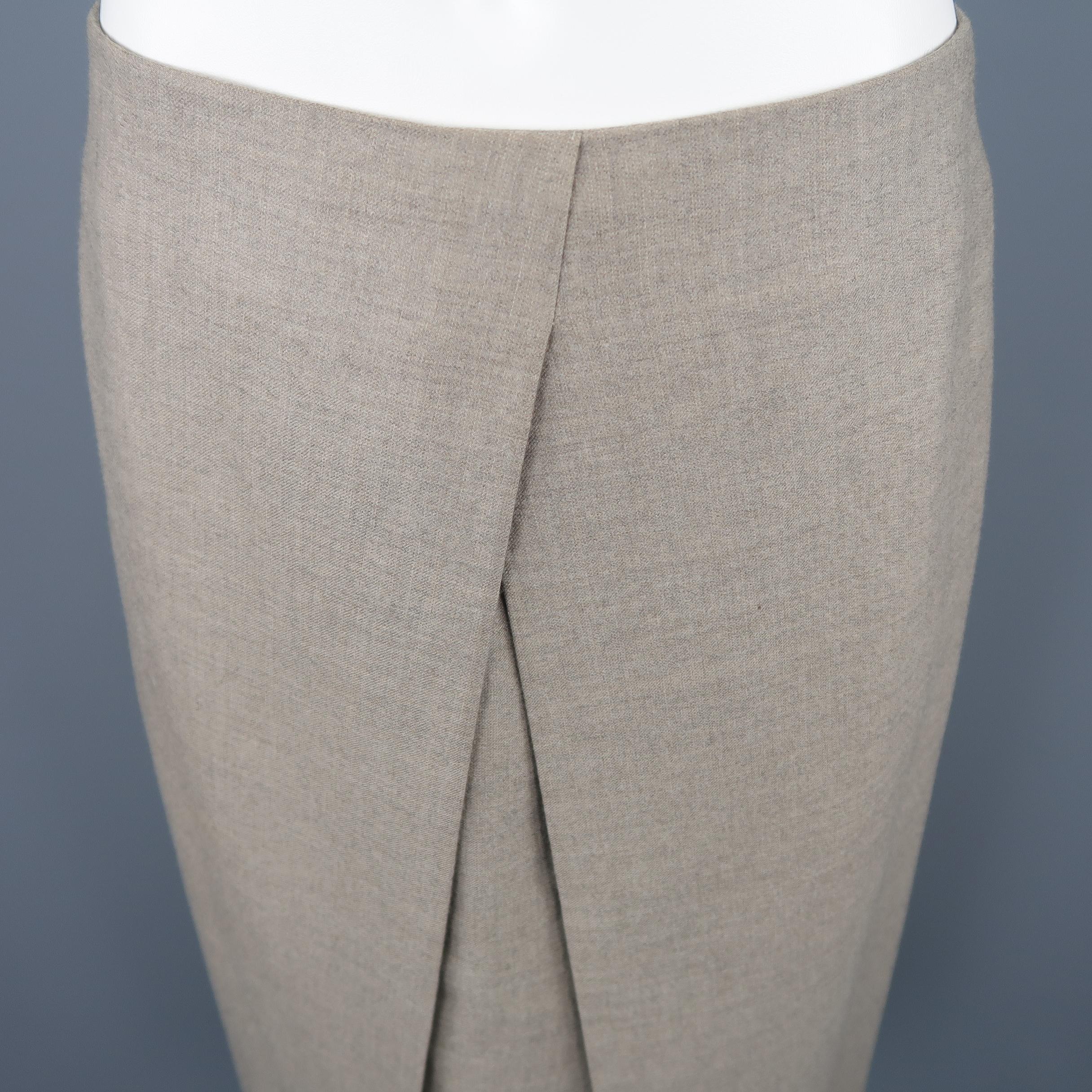 Hermes pleated A-line skirt, come in cashmere in taupe tone, with hidden zipper on the back and lined interior. Made in France.
 
Excellent Pre-Owned Condition.
Marked: 40
 
Measurements:
 
Waist: 29 in.
Hip: 38 in.
Length: 26 in.  