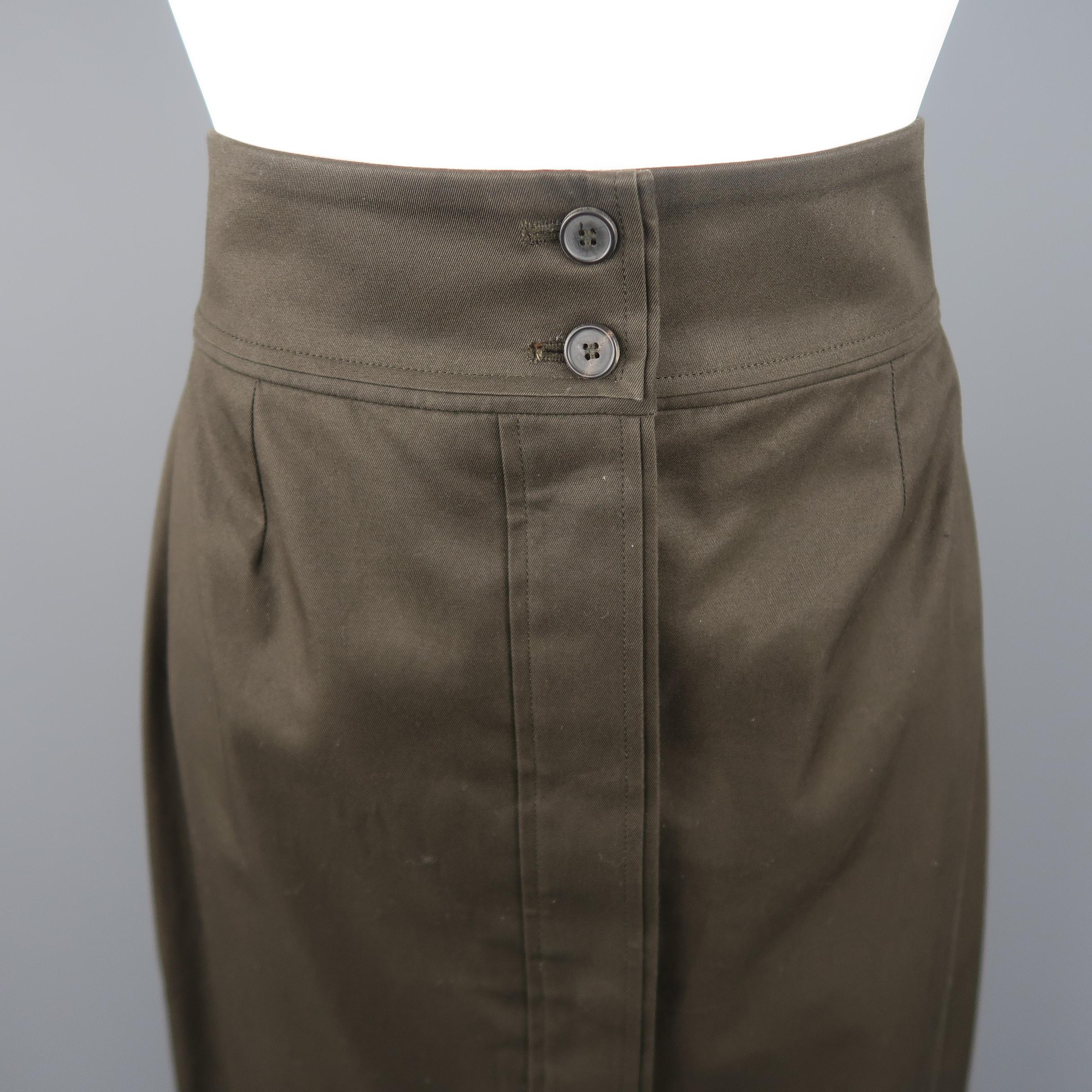 Yves Saint Laurent By Tom Ford Rive Gauche pencil skirt, come in cotton in dark green tone, with button frontal closure, pale waist and pleat details. Made in France.
 
Good Pre-Owned Condition.
Marked: FR 40
 
Measurements:
 
Waist: 29 in.
Hip: 39