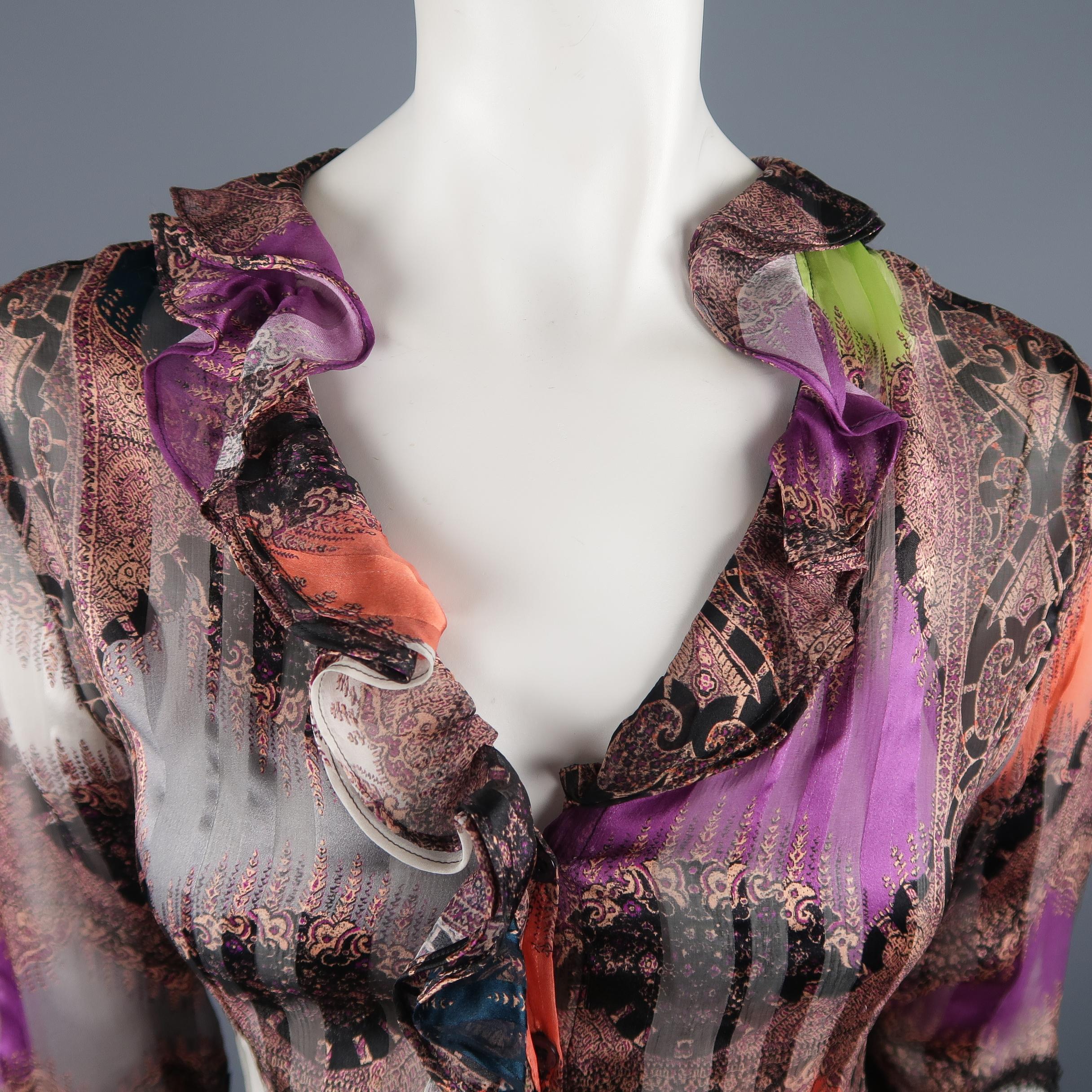 Etro blouse comes in silk opaque stripe textured chiffon with an overall abstract paisley print ruffled collar, ruffled cuffs, and black lace sleeve panels. Made in Italy.
 
Excellent Pre-Owned Condition.
Marked: IT 46
 
Measurements:
 
Shoulder: 15