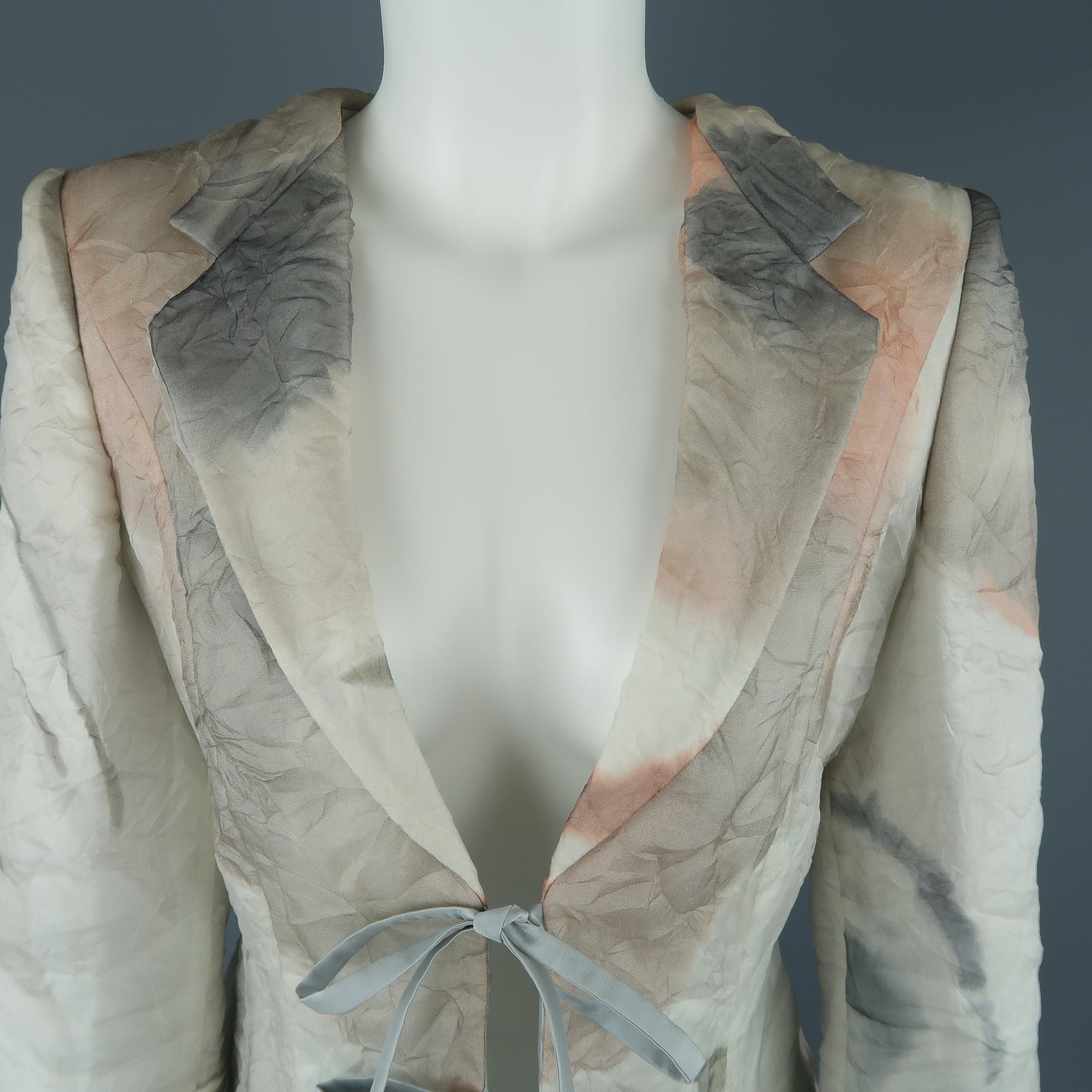 Giorgio Armani evening jacket comes in a gorgeous abstract marble print wrinkled textured silk organza overlay fabric with a strong shoulder, wide neckline with notch lapel, slit cuffs, and double tied closure. Made in Italy.
 
Excellent Pre-Owned