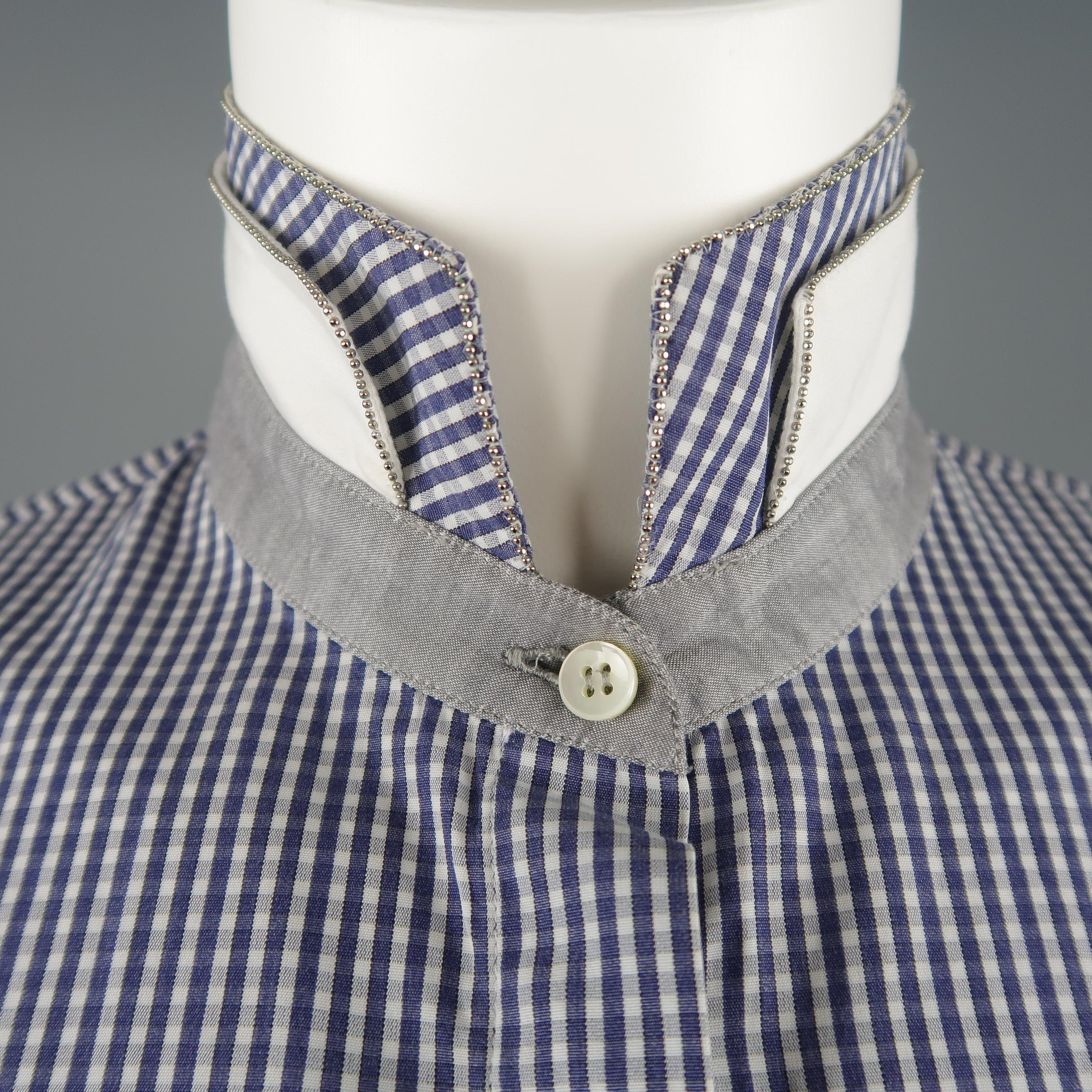 BRUNELLO CUCINELLI blouse comes in navy and white gingham plaid cotton with silver tone metal beaded Monili trim, hidden placket button up front, and double collar. Made in Italy.
 
Good Pre-Owned Condition.
Marked: M
 
Measurements:
 
Shoulder: 15