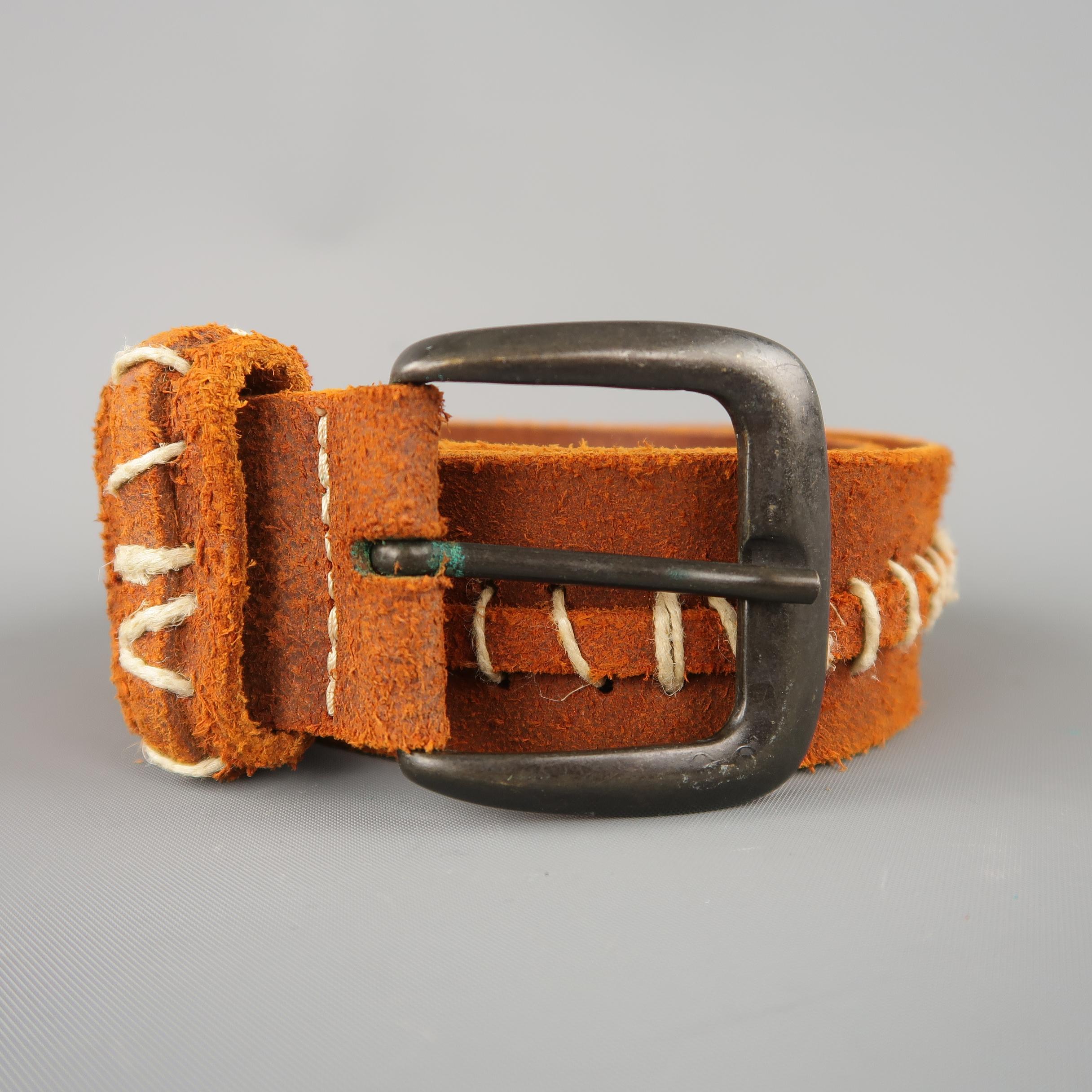 MAISON MARTIN MARGIELA belt comes in brick orange red distressed sueded leather with contrast stitch details throughout and a gunmetal buckle. Made in Italy.
 
Excellent Pre-Owned Condition.
Marked: 90
 
Length: 43.5 in.
Width: 1.5 in.
Fits: