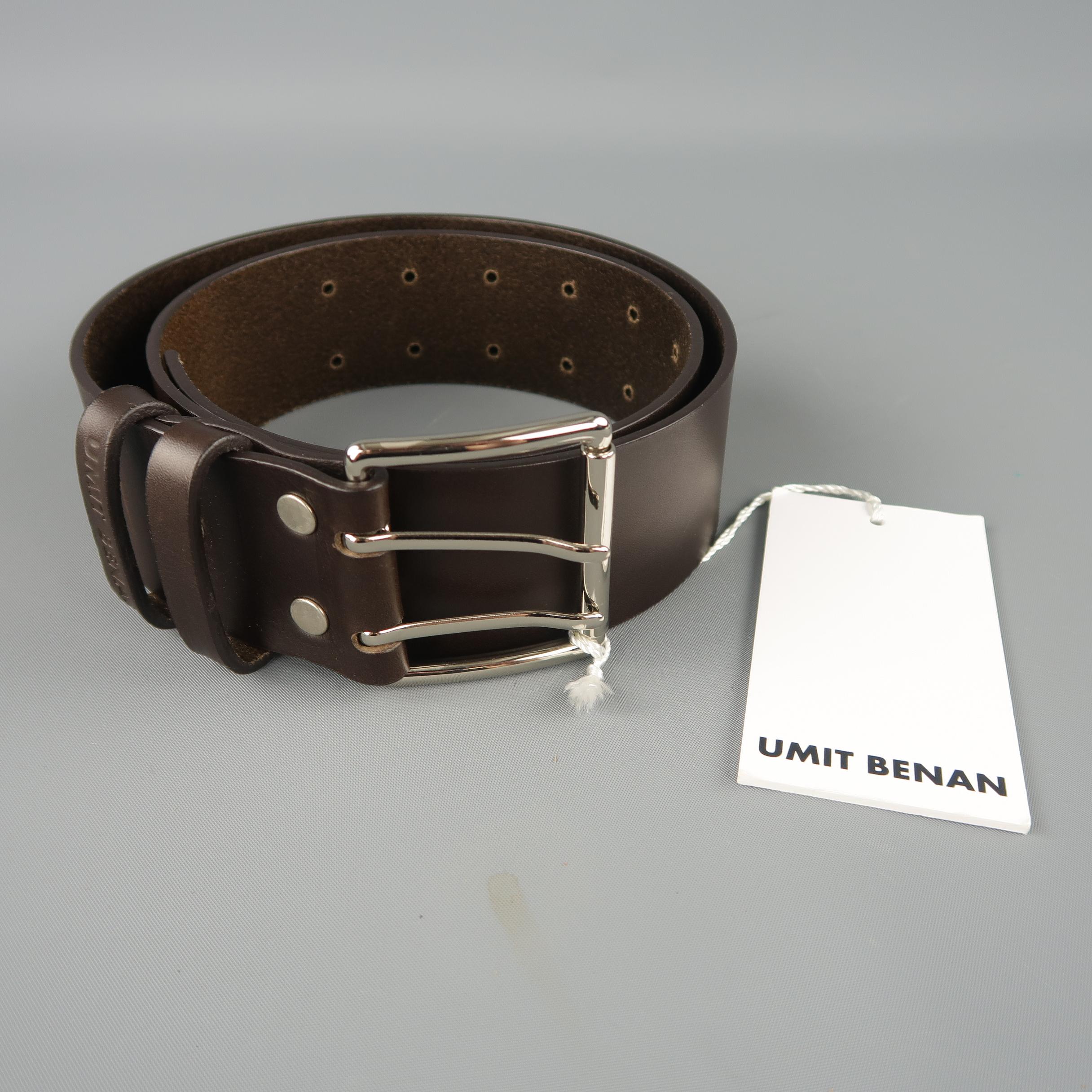 UMIT BENAN belt features a thick dark brown leather strap with a silver tone double prong buckle. Made in Italy.
 
New with Tags.
Marked: 84
 
Length: 40 in.
Width: 1.75 in.
Fits: 26-35 in.