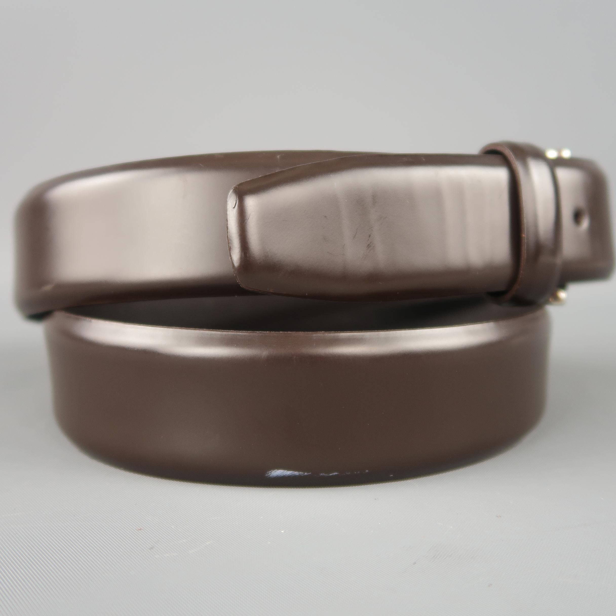 ERMENEGILDO ZEGNA dress belt features a smooth dark brown leather strap with a silver tone brass buckle. Wear.  Made in Italy.
 
Good Pre-Owned Condition.
Marked: 110 / 95
 
Length: 44 in.
Width: 1.25 in.
Fits: 36-40 in.