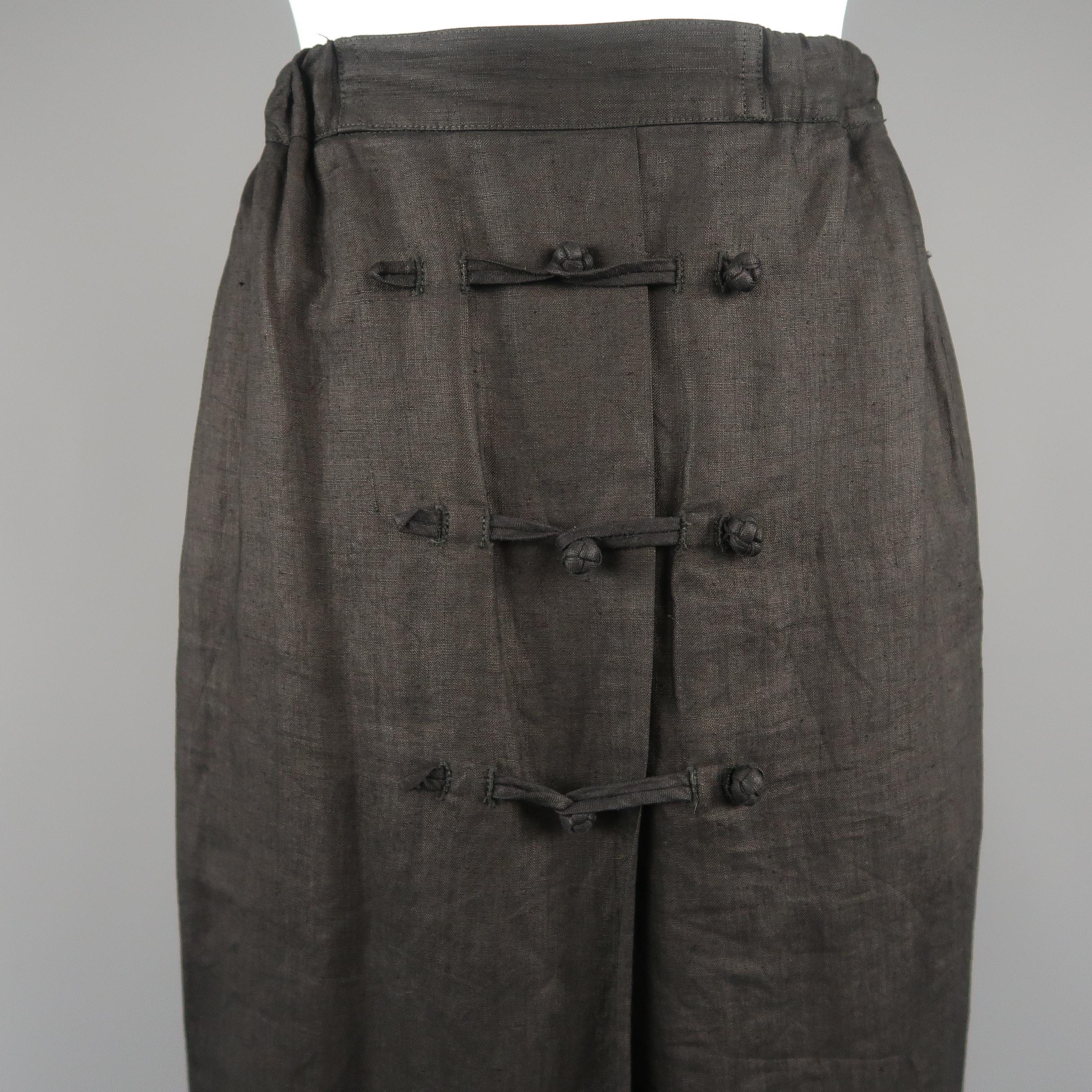 Vintage ISSEY MIYAKE A-line skirt comes in black linen with a faux wrap front, triple toggle closures, and elastic back waistband.
 
Good Pre-Owned Condition.
Marked: S
 
Measurements:
 
Waist: 23 in.
Hips: 38 in.
Length: 33 in.