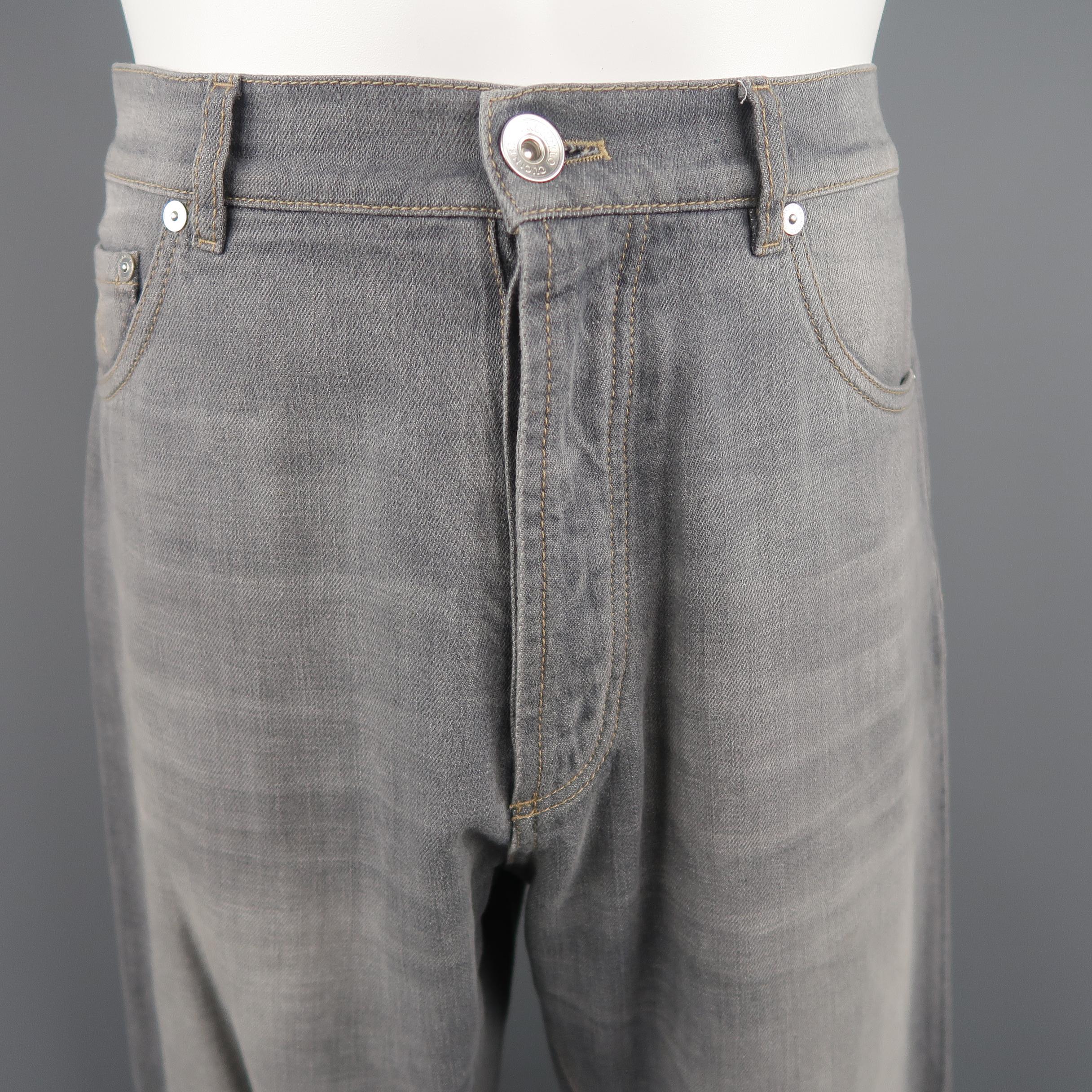 BRUNELLO CUCINELLI jeans come in light gray washed denim with a button fly and darted knee. Made in Italy.
 
Good Pre-Owned Condition. Retails: $795.00.
Marked: Leisure Fit (no size)
 
Measurements:
 
Waist: 34 in.
Rise: 12 in.
Inseam: 34 in.