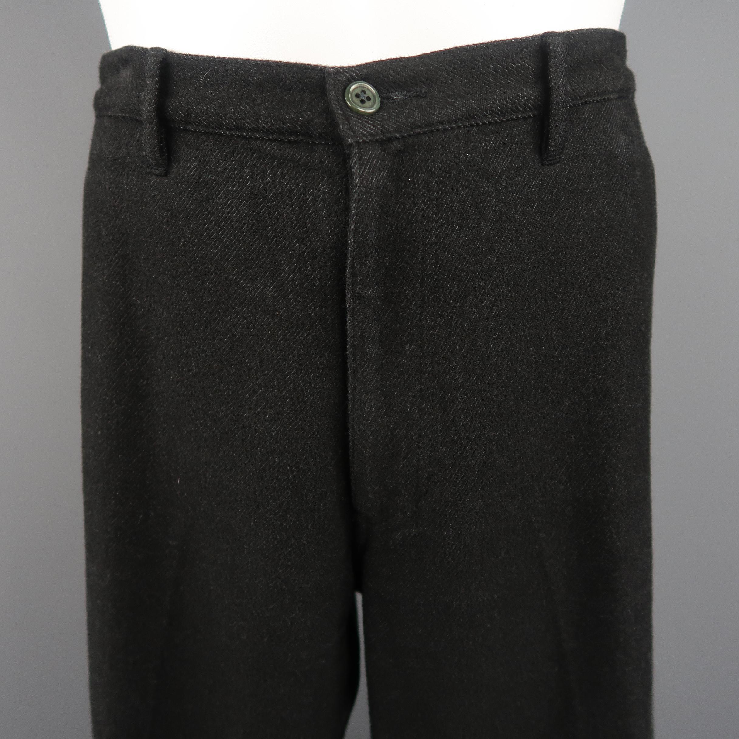 COMME des GARCONS HOMME PLUS trousers come in a soft cotton blend twill with a subtle washed effect, zip fly, and green buttons. Circa 2004. Made in Japan.
 
Good Pre-Owned Condition.
Marked: L
 
Measurements:
 
Waist: 34 in.
Rise: 11 in.
Inseam: 34