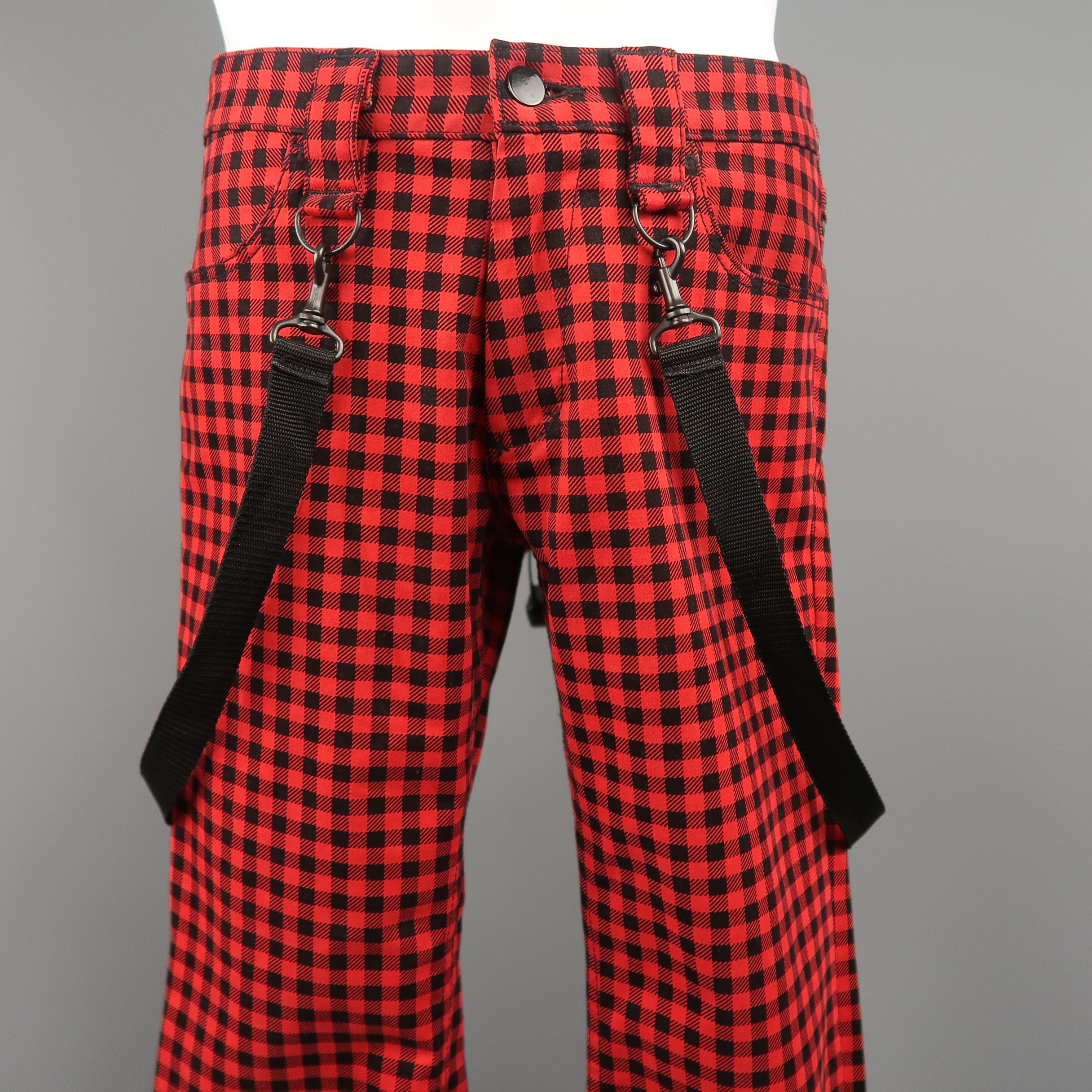 NUMBER (N)INE jeans come in red and black gingham plaid stretch cotton with black webbing detachable bondage strap. Made in Japan. Excellent Pre-Owned Condition.
Marked: JP 2
 
Measurements:
Waist: 32 in.
Rise: 8.5 in.
Inseam: 34 in.