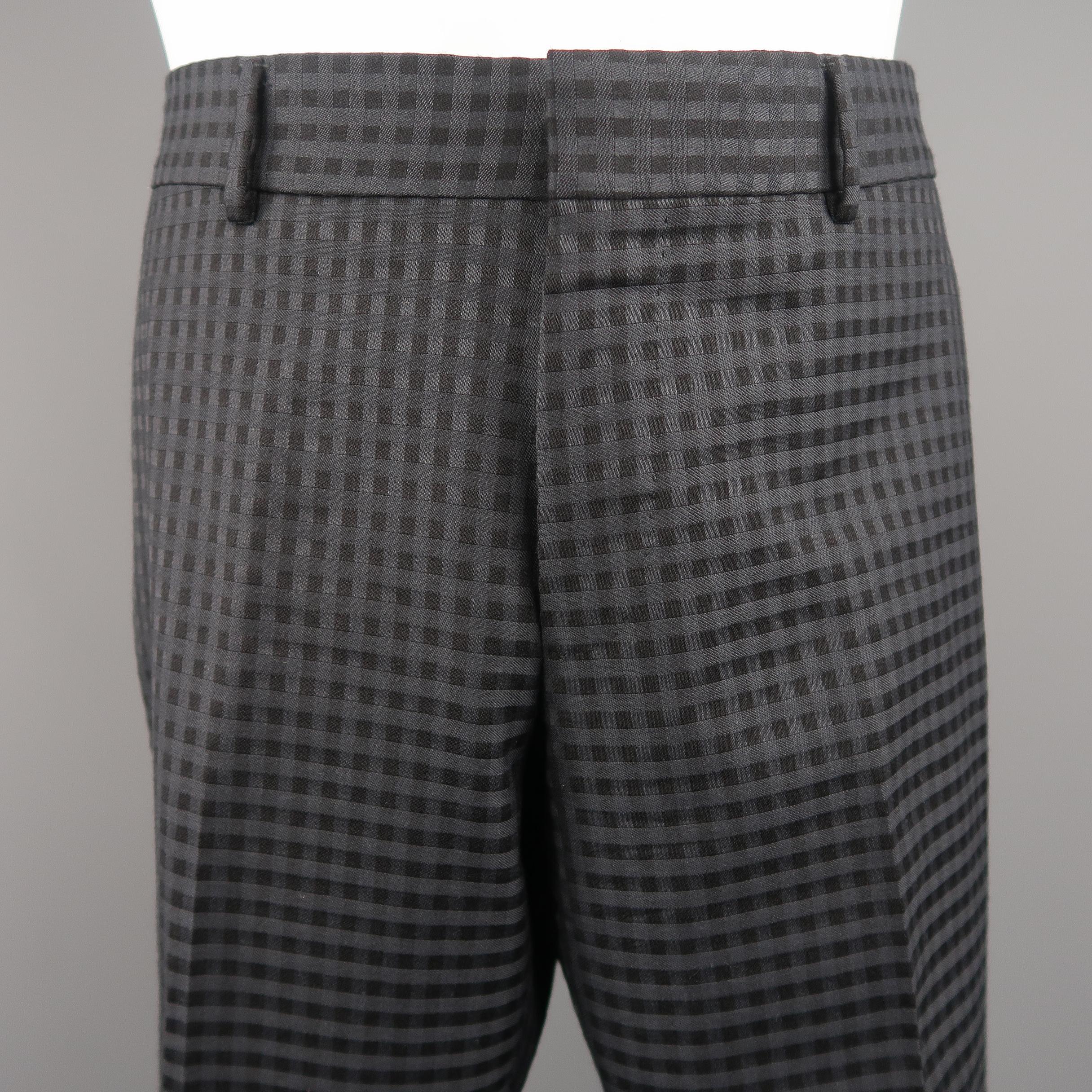 GUCCI flat front dress pants come in gingham plaid textured wool material with a tapered leg and faux slit back pockets. Made in Switzerland.
Excellent Pre-Owned Condition.
Marked: IT 48
 
Measurements:
Waist: 36 in.
Rise: 9 in.
Inseam: 30 in.