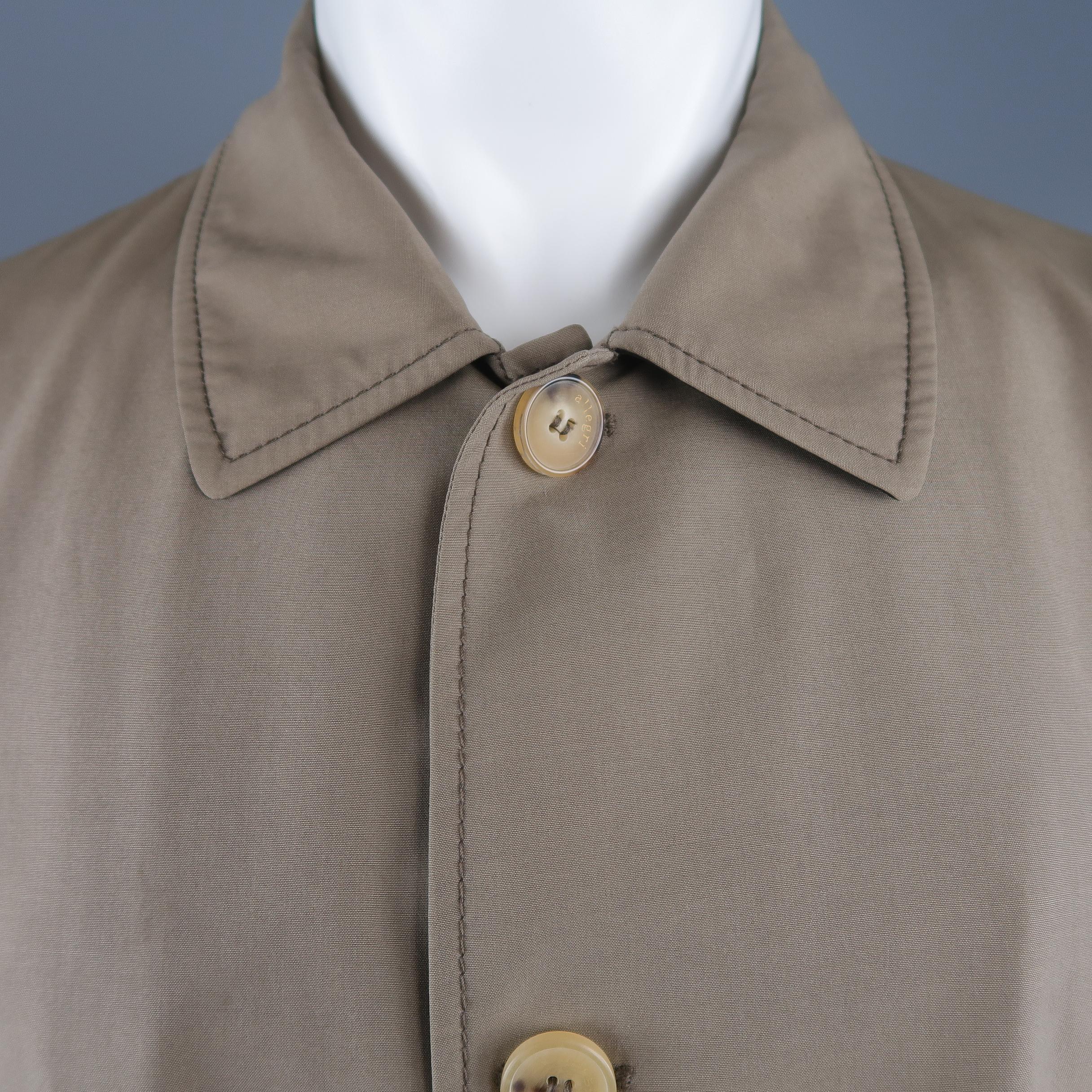 ALLEGRI car coat comes in dark khaki wool blend fabric with a pointed collar, button up front, tab cuffs, and zip pockets. Stain on chest. As-is.  Made in Italy.
 
Good Pre-Owned Condition.
Marked: IT 50
 
Measurements:
 
Shoulder: 19 in.
Chest: 46