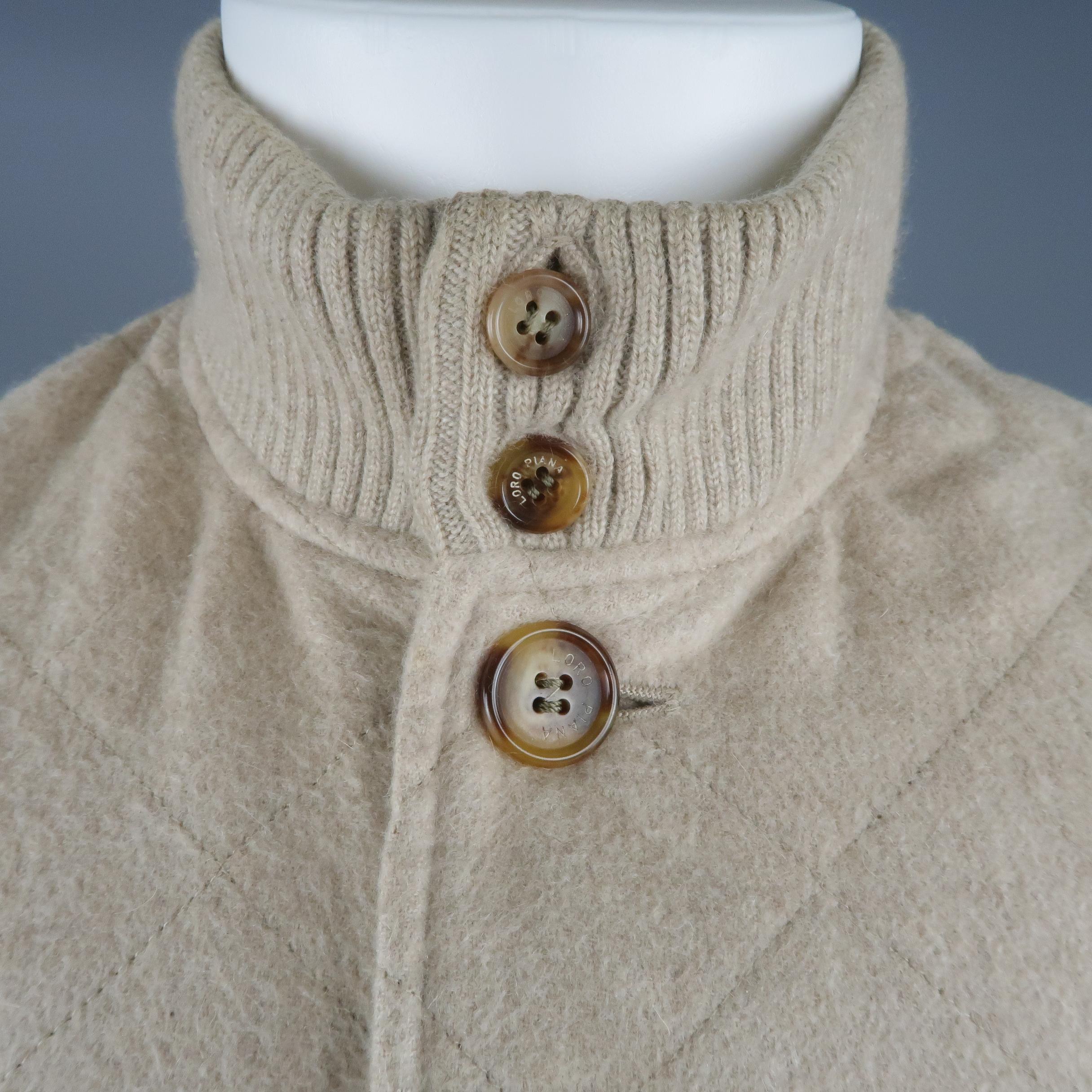 LORO PIANA vest comes in quilted oatmeal beige cashmere with a button up front, high ribbed collar and waist, and slanted pockets. Made in Italy.
 
Excellent Pre-Owned Condition. Retails: $ 2,595.00.
Marked: S
 
Measurements:
 
Shoulder: 18