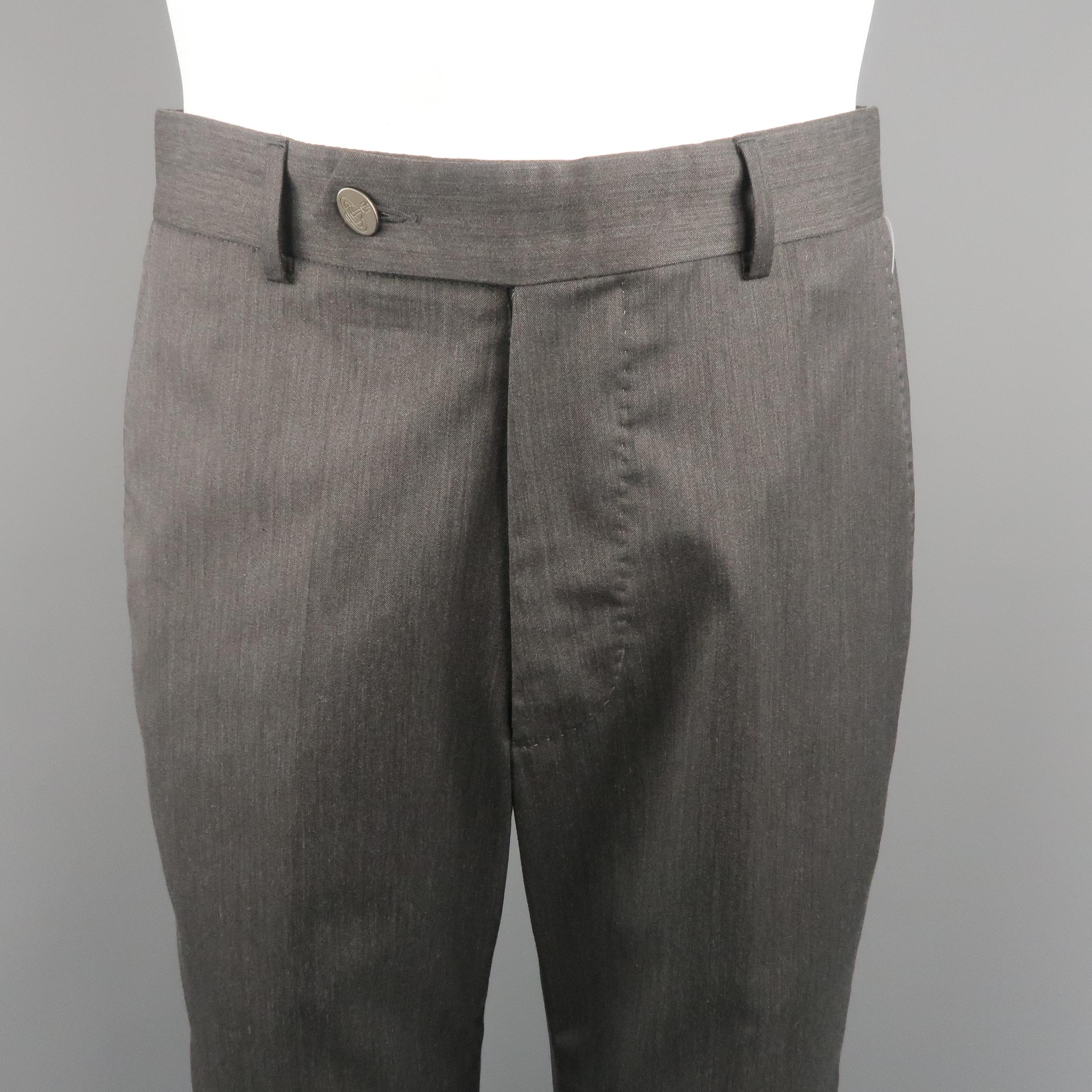 VIVIENNE WESTWOOD dress pants come in solid wool / nylon material, in charcoal tone, with front tab, slant side pocket and flat front. Small signals of use on the back of the right leg. Made in Italy.
 
Excellent Pre-Owned Condition.
Marked: 48 IT
