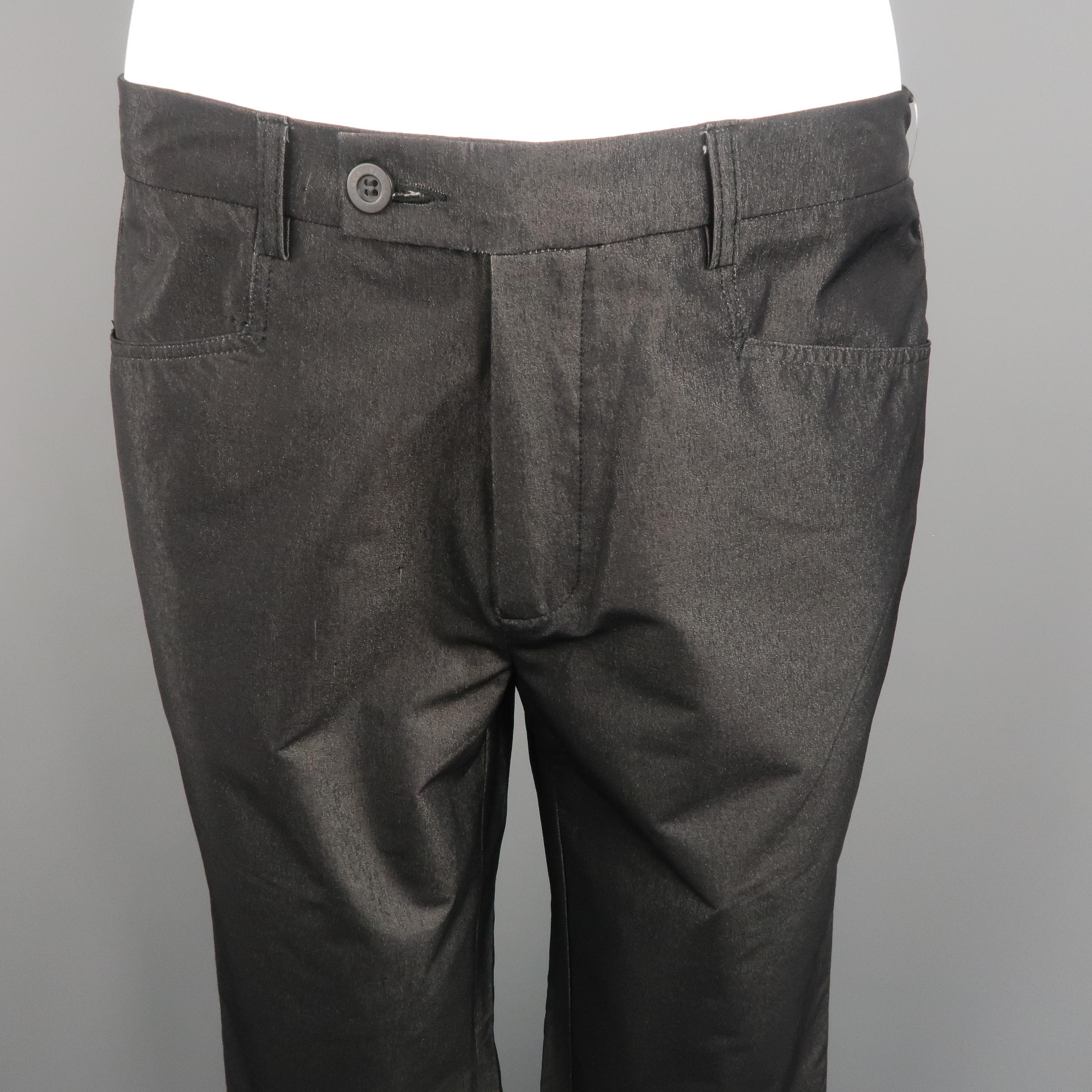 GIANNI VERSACE dress pants come in metallic charcoal tone, cotton blend material with waistband, piped pockets and zip fly. Small signals of use, with minor pilling on the right side of the front. Made in Italy.
 
Excellent Pre-Owned