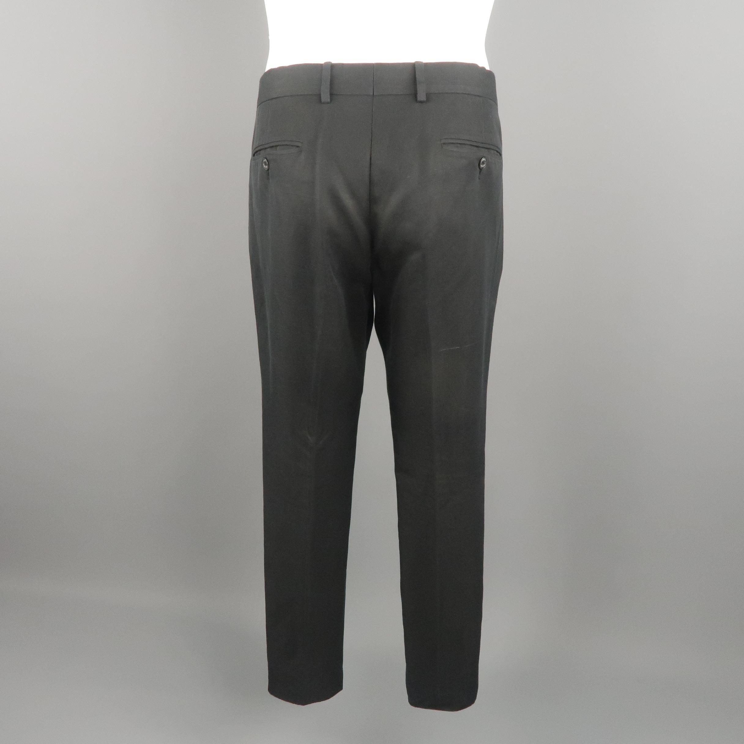 GUCCI dress pants come in black tone, solid cotton / linen material with slant side pockets. Small marks of use overall and fading color. Made in Italy.
 
Good Pre-Owned Condition.
Marked: 50 R  IT
 
Measurements:
 
Waist: 37 in.
Rise: 10