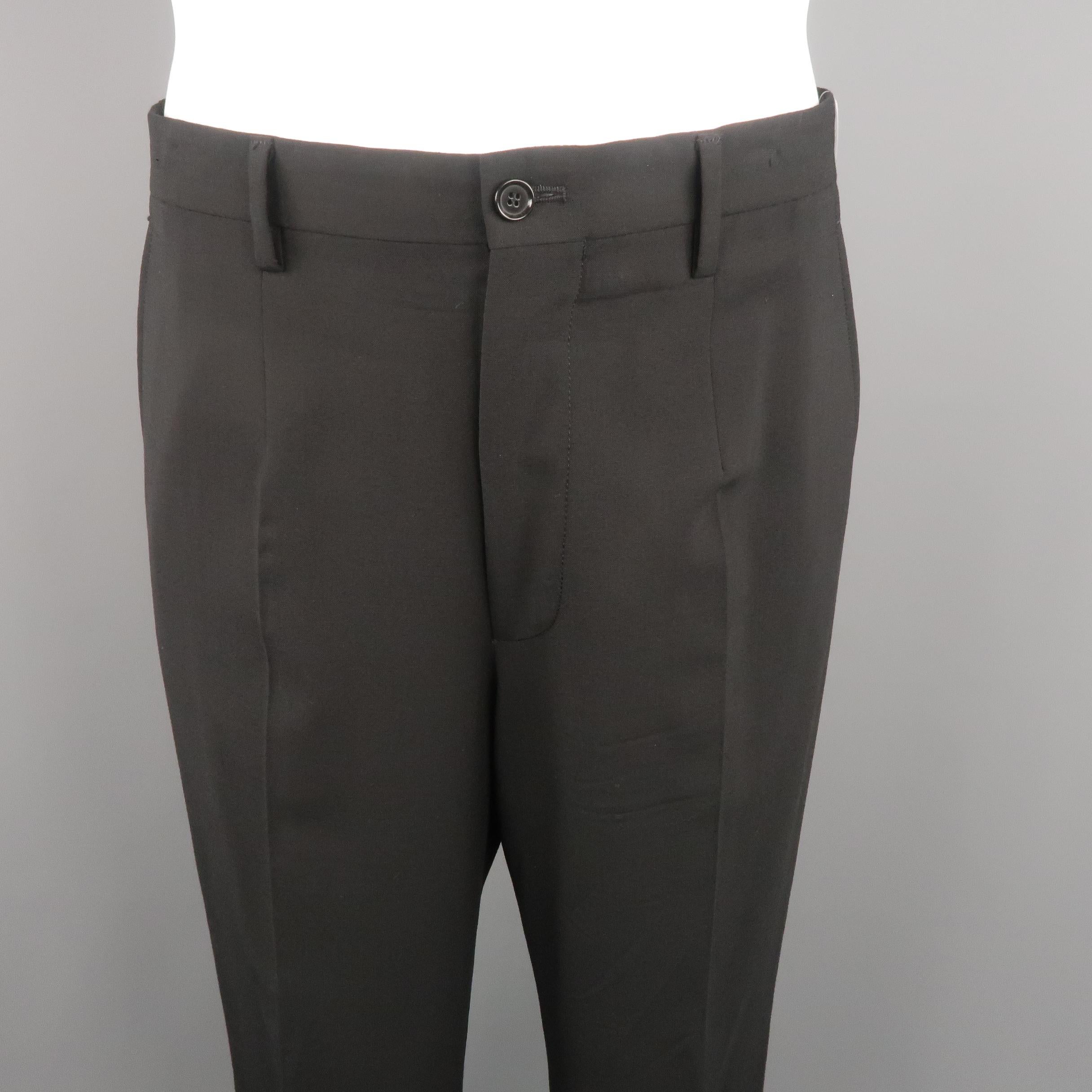 DOLCE & GABBANA dress pants come in black tone, solid wool blend material with slant side pockets and zip fly. Small signs of use, minor marks. Made in Italy.
 
Excellent Pre-Owned Condition.
Marked: 50 IT
 
Measurements:
 
Waist: 34 in.
Rise: 12