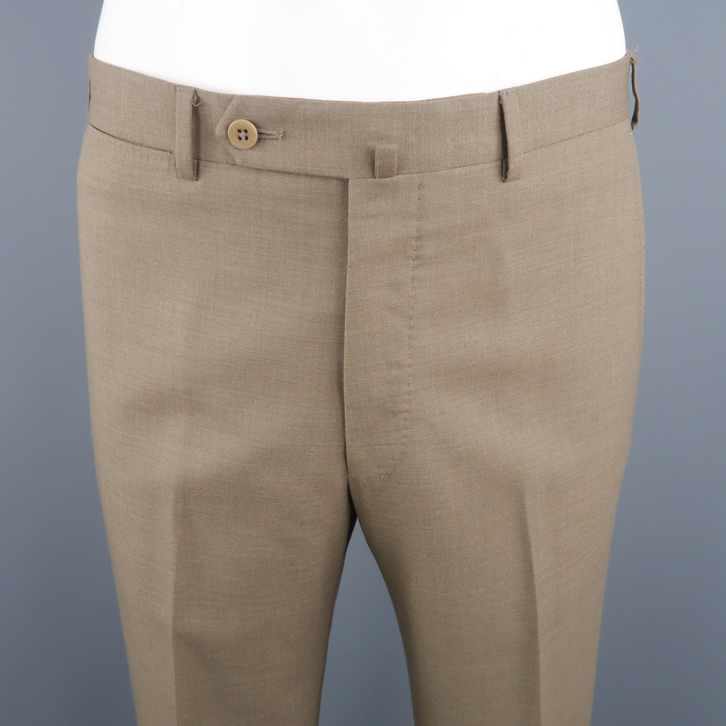 ERMENEGILDO ZEGNA dress pants come in olive tone, wool material with a front tab, slant side pockets and cuffed hem. Made in Romania.
 
Excellent Pre-Owned Condition.
Marked: 33 R  US
 
Measurements:
 
Waist: 35 in.
Rise: 11 in.
Inseam: 32 in.