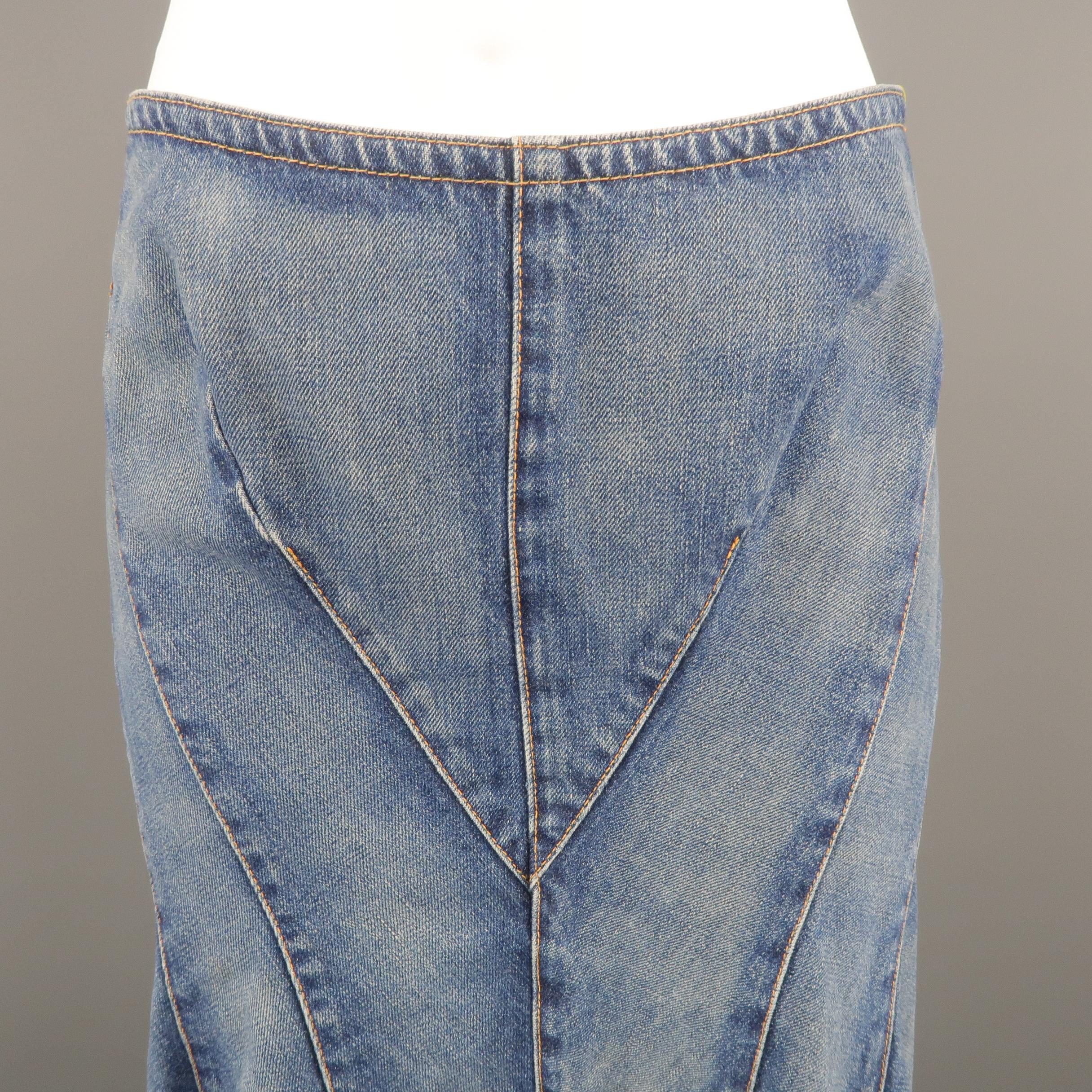 JUNYA WATANABE trumpet skirt comes in a light blue tone washed denim material, featuring visible stitches throughout. Small signals of use, small mark close to the hem on the front.  Made in Japan.
 
Excellent Pre-Owned Condition.
Marked: S
