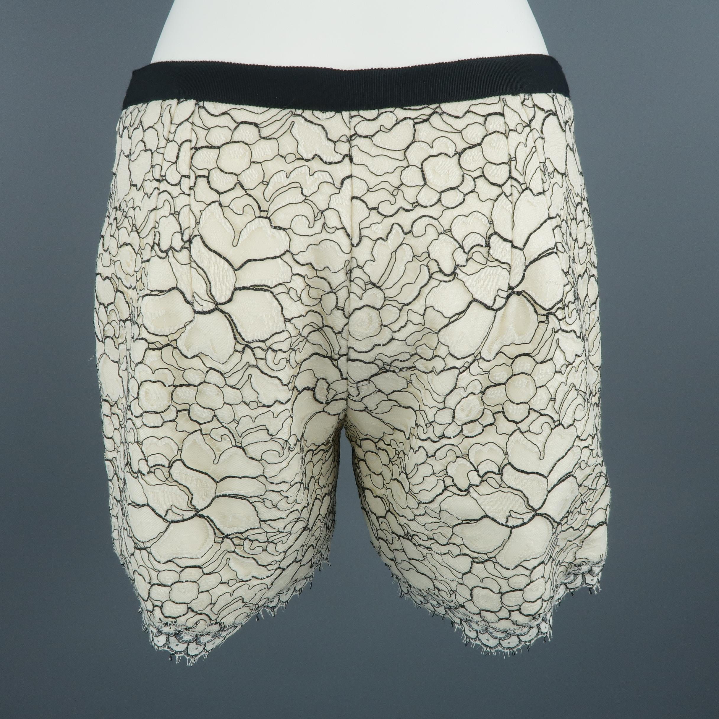 ANDREW GN shorts, come in white and black tones, wool and floral lace material, with black ribbons and slant side pockets. Made in France.
 
Excellent Pre-Owned Condition.
Marked: 38 FR
 
Measurements:
 
Waist: 29 in.
Rise: 8.5 in.
Inseam: 5 in.