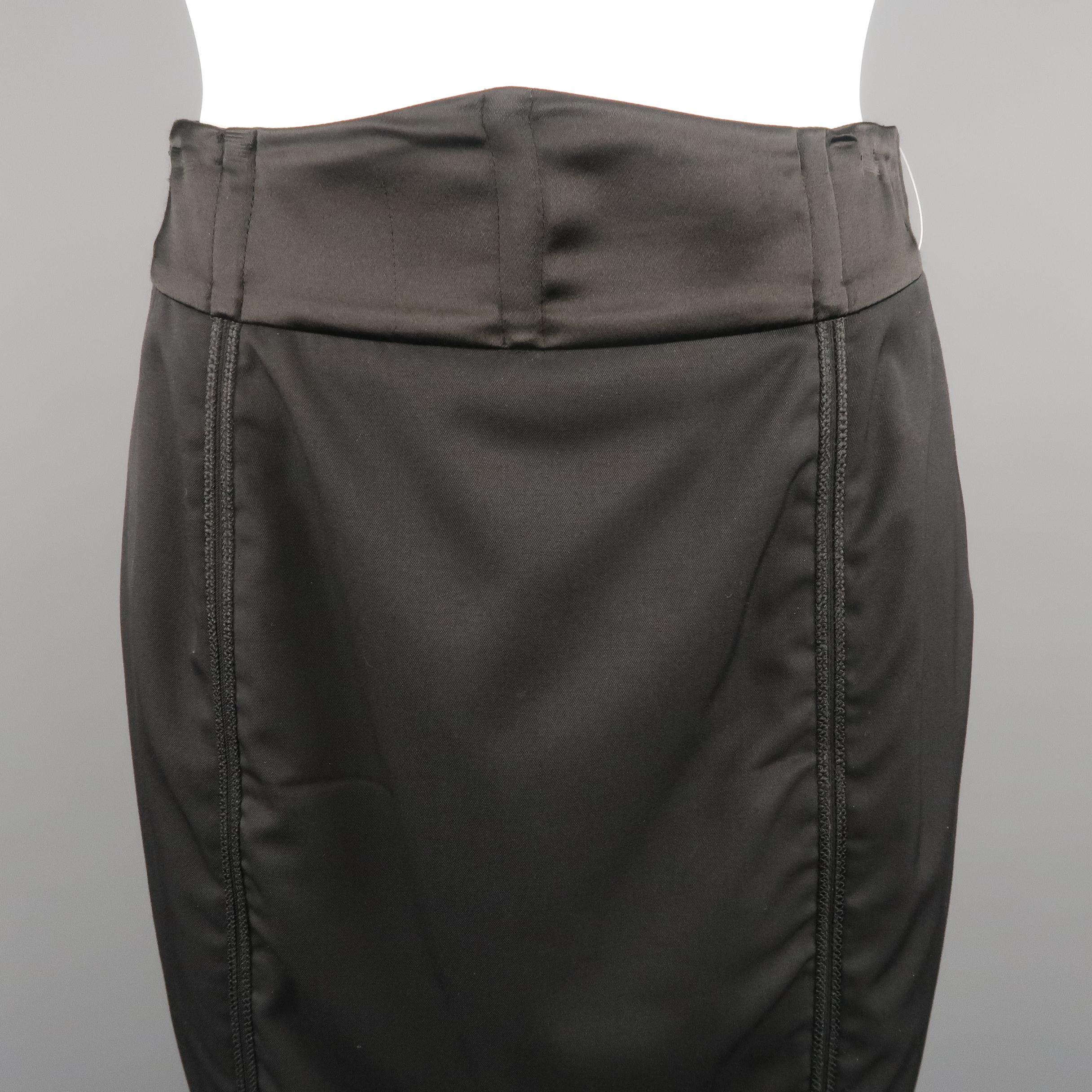 STELLA McCARTNEY pencil skirt, come in black tone and wool blend, with trim details on top, double asymmetrical zipper and satin waistband. Presenting some peeling close to the zipper. Made in Italy.
 
Excellent Pre-Owned Condition.
Marked: 42 IT
