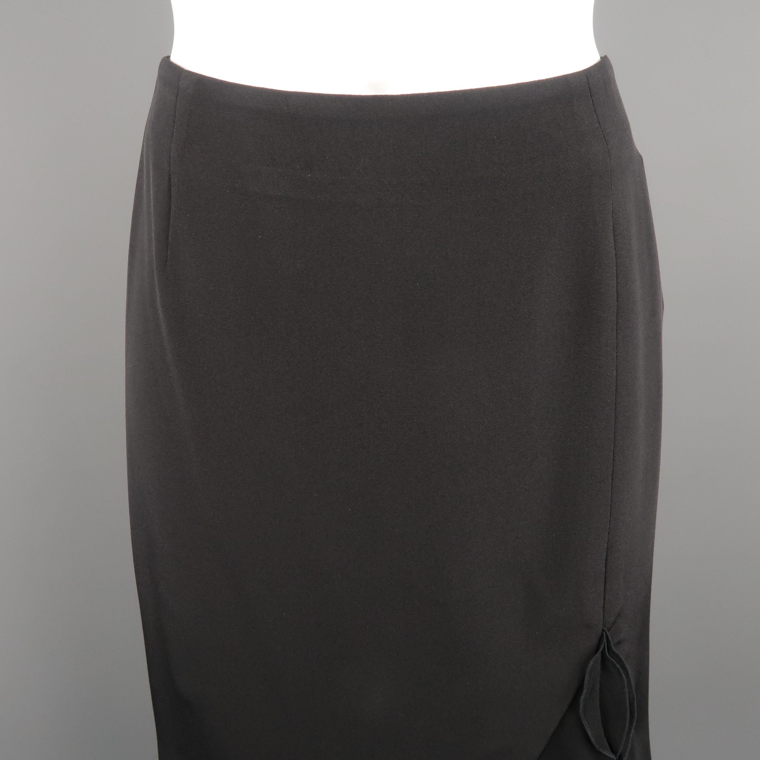 ESCADA classic A-line skirt, come in black tone in silk crepe material, with ruffled hem and lateral zipper. Small signal of use, with a light mark on the ruffle on the right back, needs to be dry cleaned. Made in Germany.
 
Excellent Pre-Owned