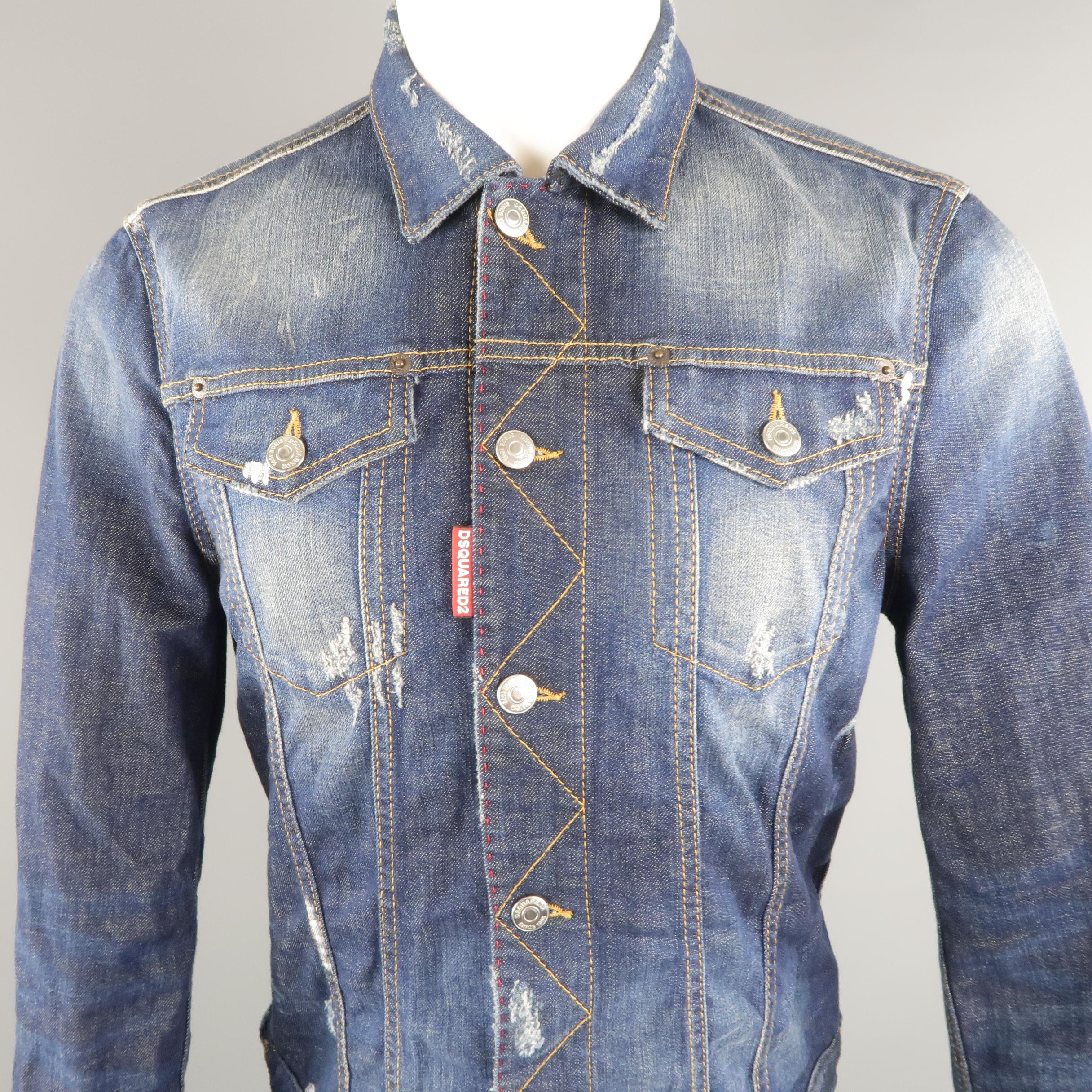 DSQUARED2 trucker jacket come in indigo denim, contrast stitches, patch flap  pockets, distressed and painted details throughout, and red zipper on the cuffs. Made in Italy.
 
Excellent Pre-Owned Condition.
Marked: 52 IT
Measurements:
 
Shoulder: 17