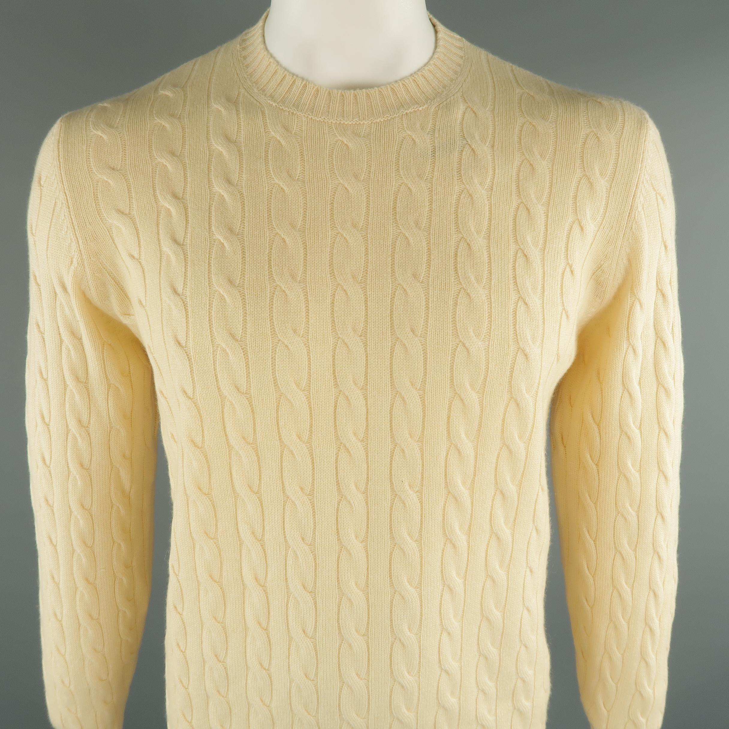 BRUNELLO CUCINELLI sweater comes in 100% cashmere beige tone in cable knit, with a suede elbow patches, crewneck and ribbed cuff and waistband. Made in Italy.
 
New with tags.
Marked: 52 IT
 
Measurements:
 
Shoulder: 18 in.
Chest: 46 in.
Sleeve: