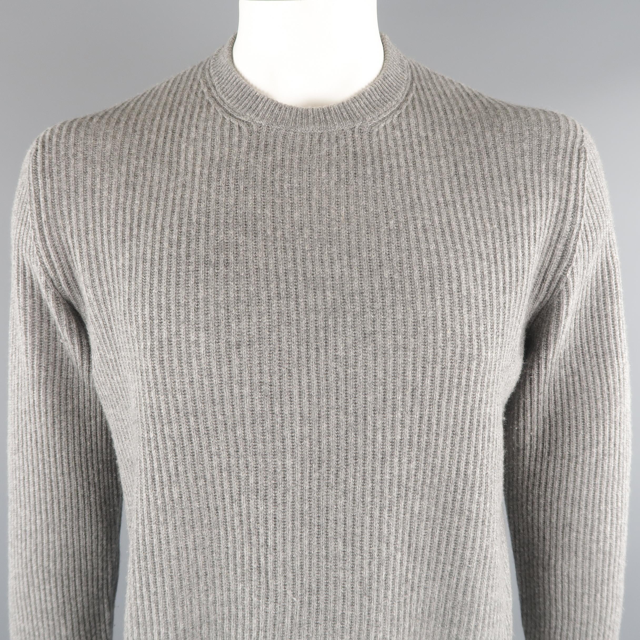 BRUNELLO CUCINELLI sweater come in 100% cashmere in a gray tone, ribbed knit, with a crewneck and ribbed cuff and waistband. Made in Italy.
 
Excellent Pre-Owned Condition.
Marked: 54 IT
 
Measurements:
 
Shoulder: 19 in.
Chest: 48 in.
Sleeve: 27