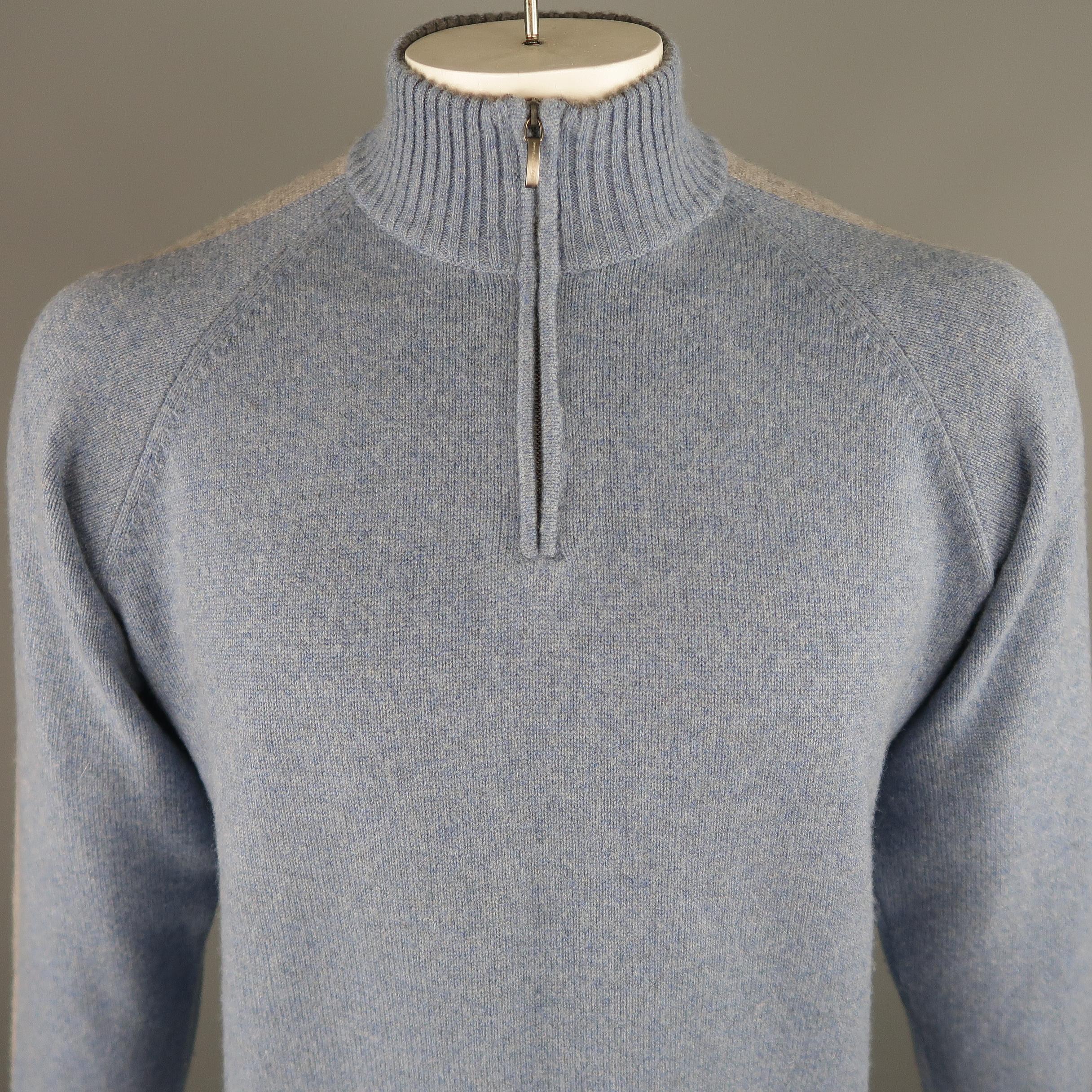 ERMENEGILDO ZEGNA sweater come in blue and grey tones in knitted cashmere, with half zip front, ribbed cuffs and waistband. Made in Italy.
 
Excellent Pre-Owned Condition.
Marked: L / 52 IT
 
Measurements:
 
Shoulder: 17.5 in.
Chest: 47 in.
Sleeve: