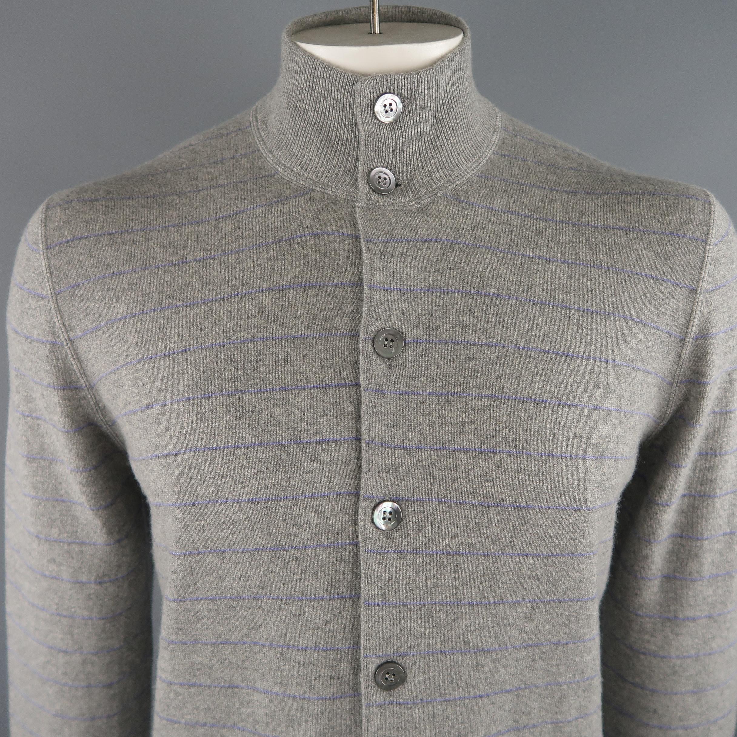 BRUNELLO CUCINELLI cardigan comes in grey and lavender tones, striped cashmere, with buttoned front, ribbed cuffs and waistband. Made in Italy.
 
New with Tags.
Marked: 52 IT
 
Measurements:
 
Shoulder: 17.5 in.
Chest: 44 in.
Sleeve: 27.5