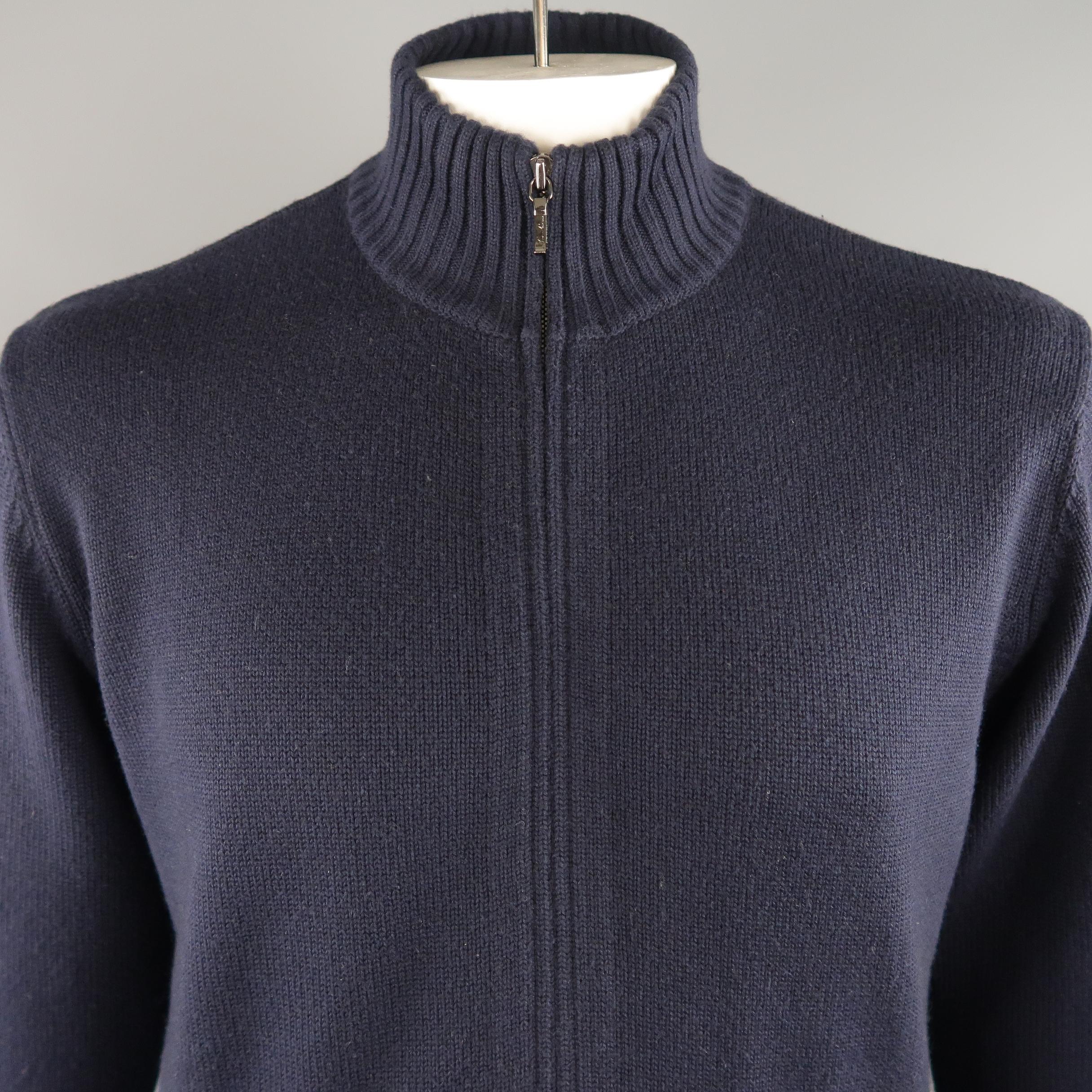 LORO PIANA jacket comes in navy tone in knitted cashmere / cotton material, with zip up front, front pockets, ribbed cuffs and waistband. Very light mark of use on the left cuff. Made in Italy.
 
Excellent Pre-Owned Condition.
Marked: 52 IT
