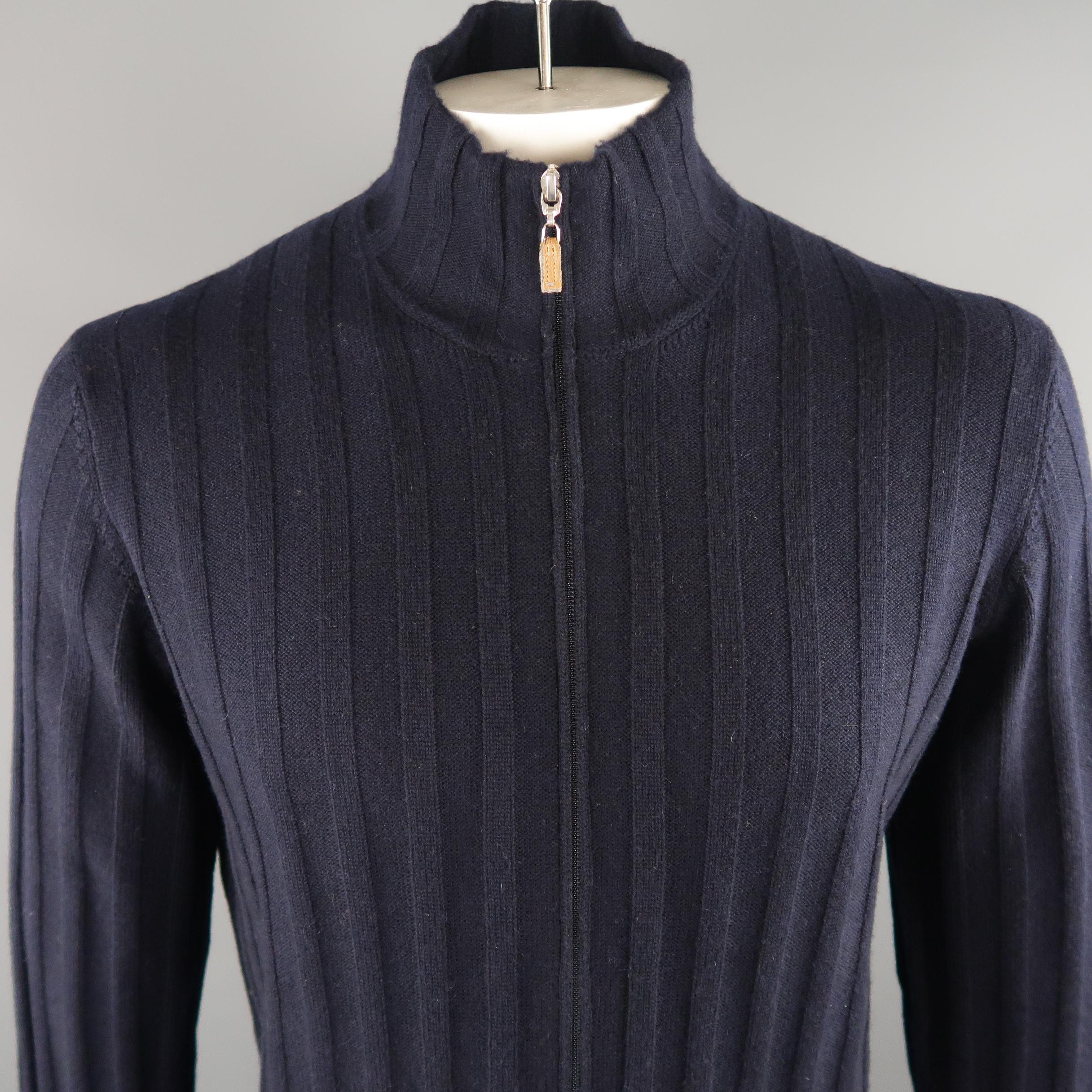 BRUNELLO CUCINELLI cardigan comes in a navy tone in knitted 100% cashmere material, with zip up front, ribbed cuffs and waistband. Made in Italy.
 
Excellent Pre-Owned Condition.
Marked: 54 IT
 
Measurements:
 
Shoulder: 18.5 in.
Chest: 46