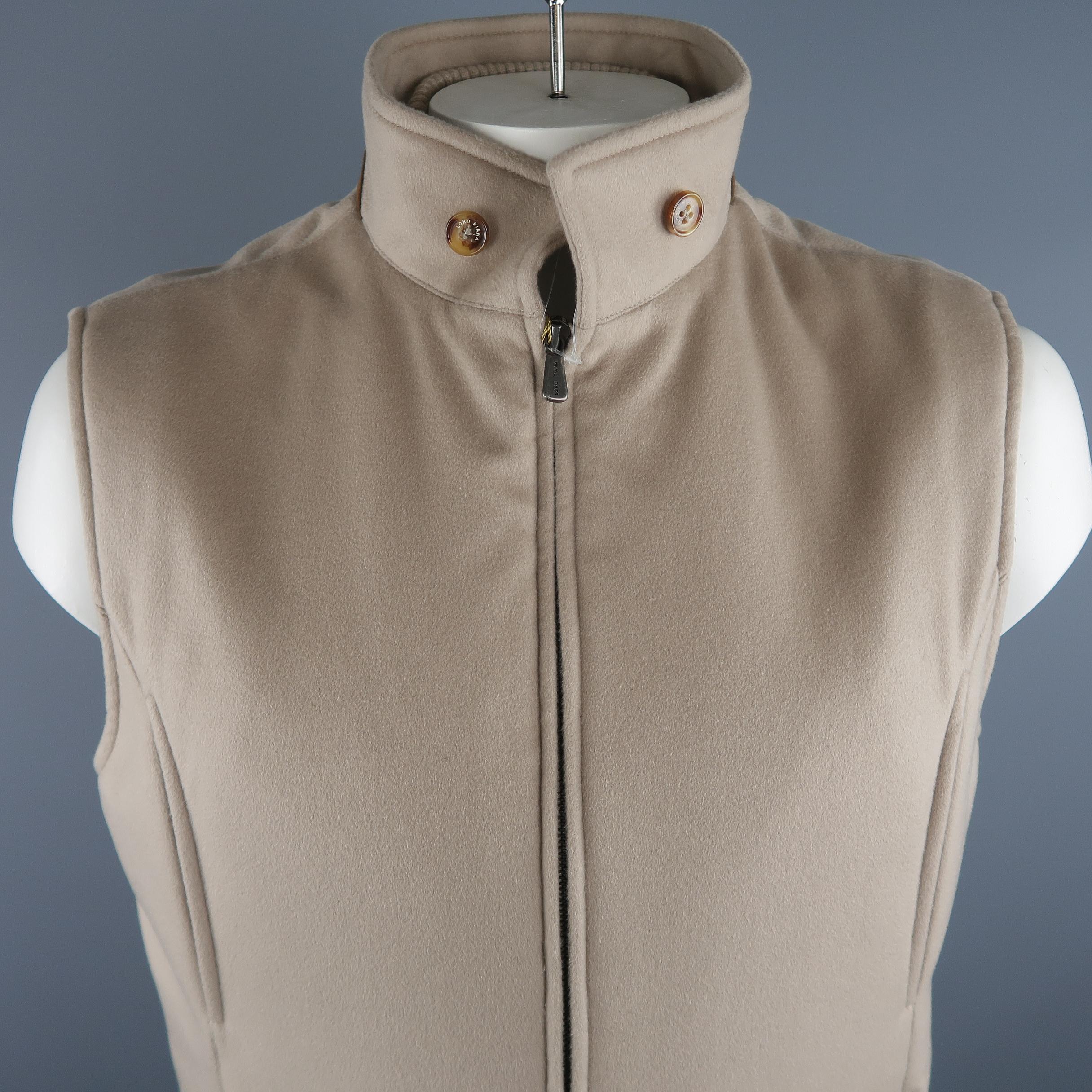 LORO PIANA vest comes in oatmeal solid cashmere material, buttons and suede trim on the collar, zip up, slit and zip pockets. Made in Italy.
 
New with Tags.
Marked: XL IT
 
Measurements:
 
Shoulder: 18 in.
Chest: 48 in.
Length: 29 in