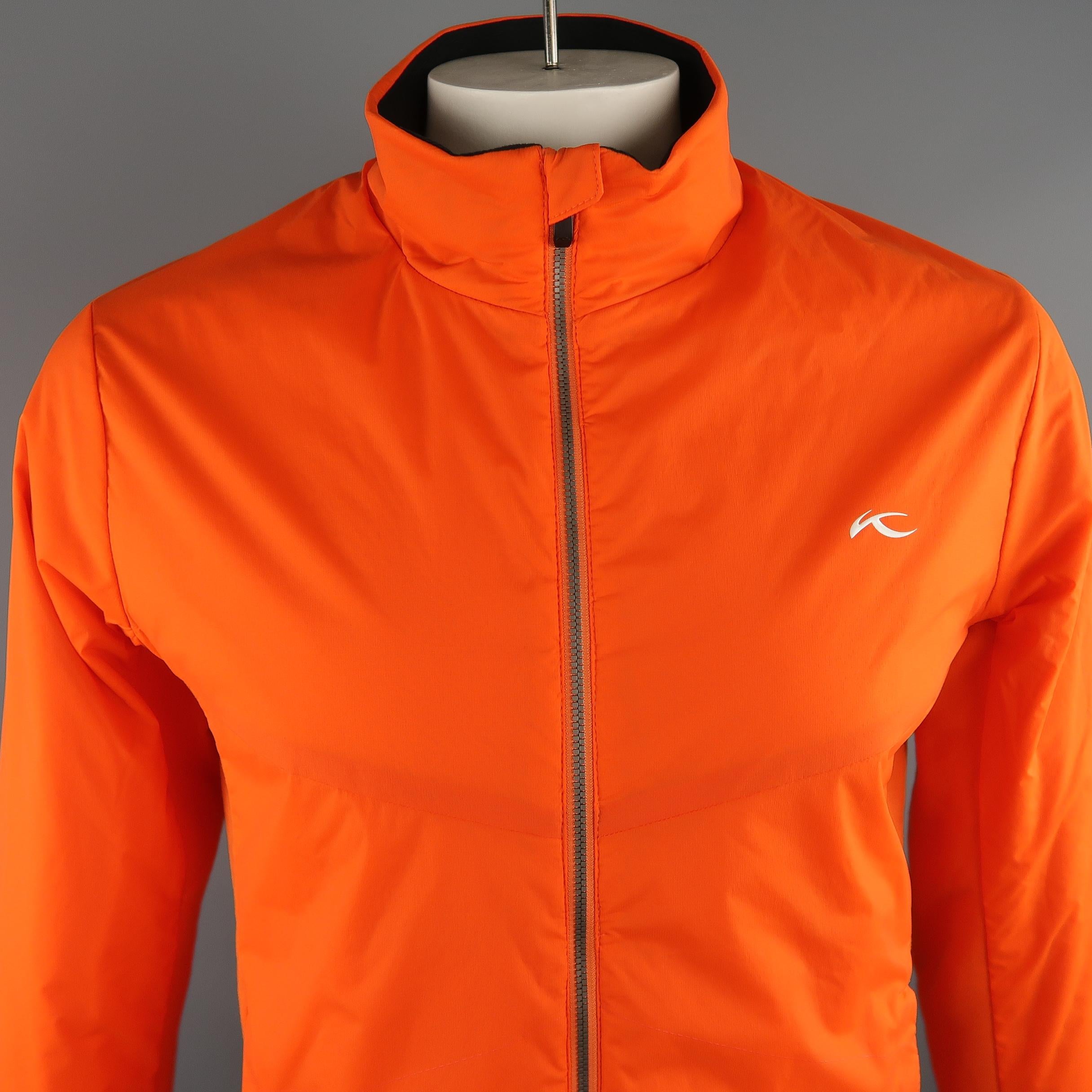 KJUS  jacket comes in a light weight orange polyamide material and features a lateral elastane padding , zip up, slit pockets. 
 
New with Tags.
Marked: 52 EU
 
Measurements:
 
Shoulder: 19 in.
Chest: 46 in.
Sleeve: 27 in.
Length: 29 in.