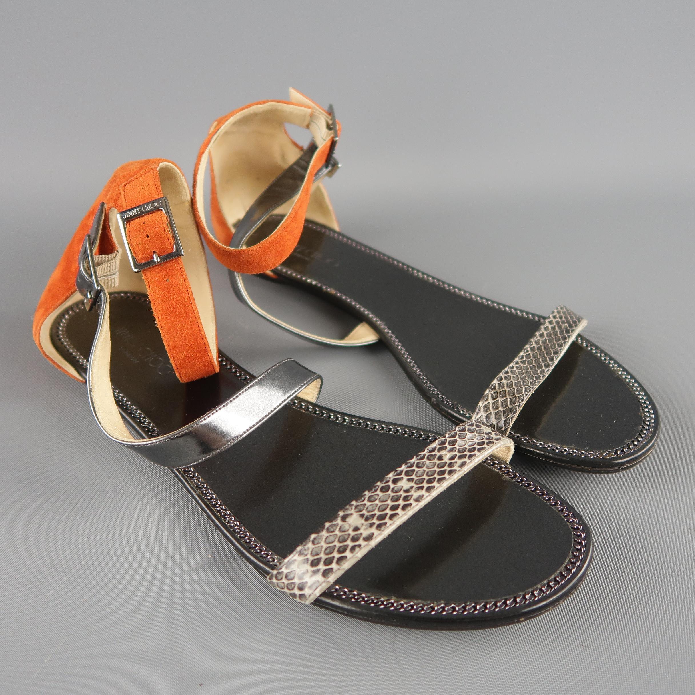 JIMMY CHOO sandals feature an orange suede heel with ankle strap, metallic smoke silver leather diagonal strap, and gray snakeskin toe strap. Made in Spain.
 
New without Tags.
Marked: IT 40