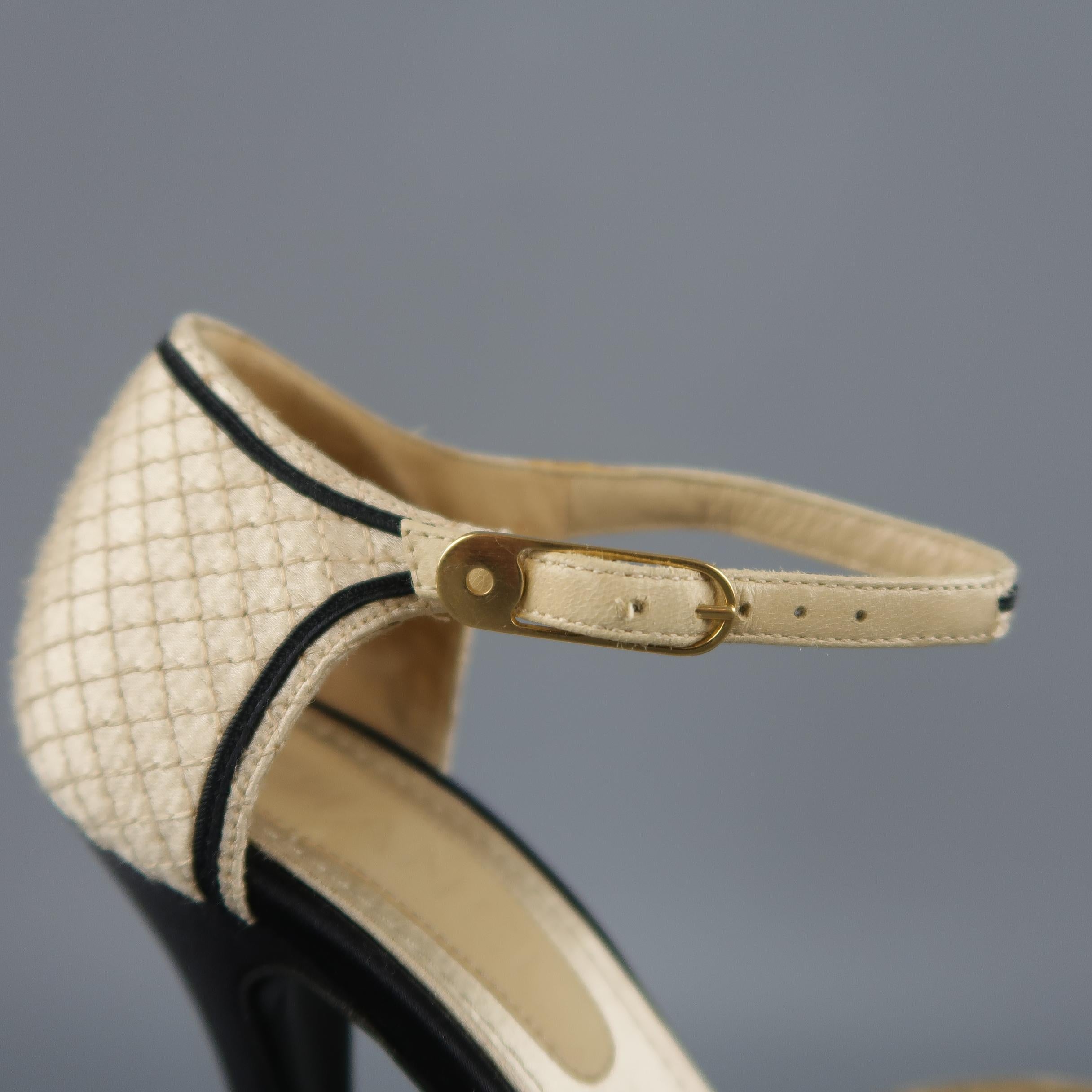 Vintage CHANEL pumps come in champagne beige quilted silk with black piping, a pointed toe with black toe cap, black covered heel, and ankle strap. Missing CC emblem on buckles. As-is. Made in Italy.
 
Good Pre-Owned Condition.
Marked: IT 37
 
Heel: