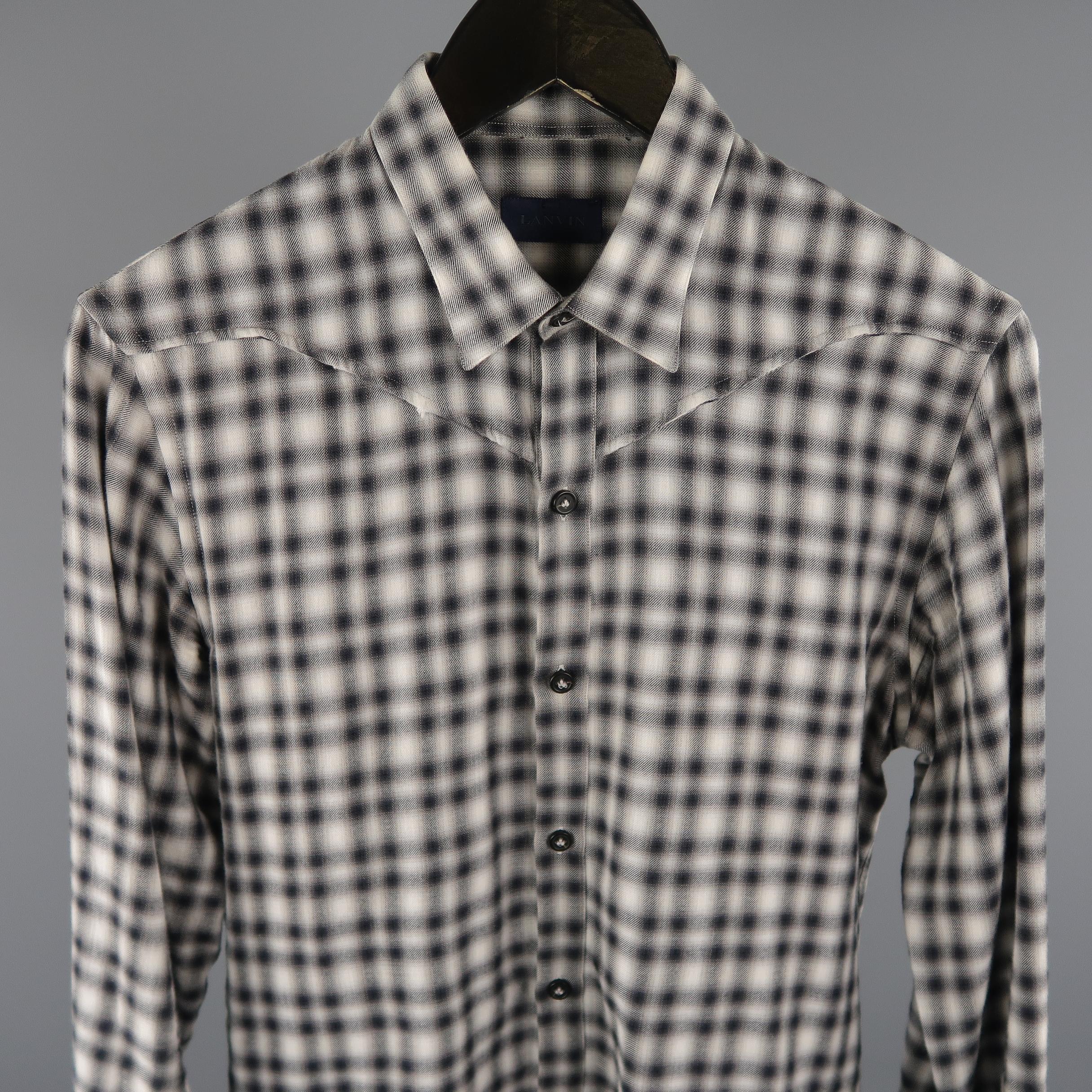 LANVIN  shirt come in tones of grey, in a plaid cotton with a pointed button down collar and long sleeves. Minor wear.  Made in Italy.
 
Good Pre-Owned Condition.
Marked: 38 IT
 
Measurements:
 
Shoulder: 16 in.
Chest: 39 in.
Sleeve: 26 in.
Length: