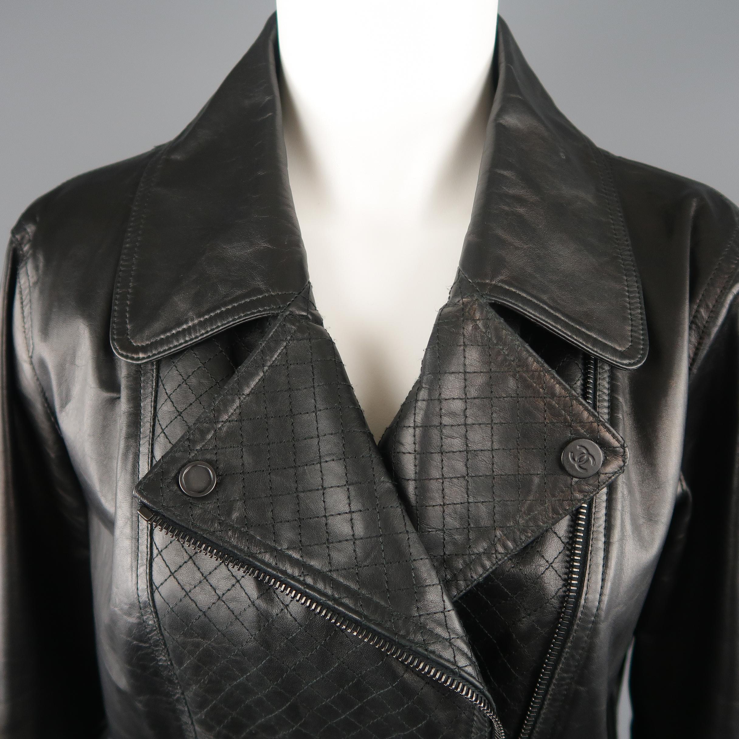 CHANEL biker jacket comes in smooth black leather with a classic collar, double breasted diagonal zip front, quilted leather panels, CC patch sleeve, and black zippers with CC emblem pulls. Minor Alteration / Tailored waist by Chanel. Measurements